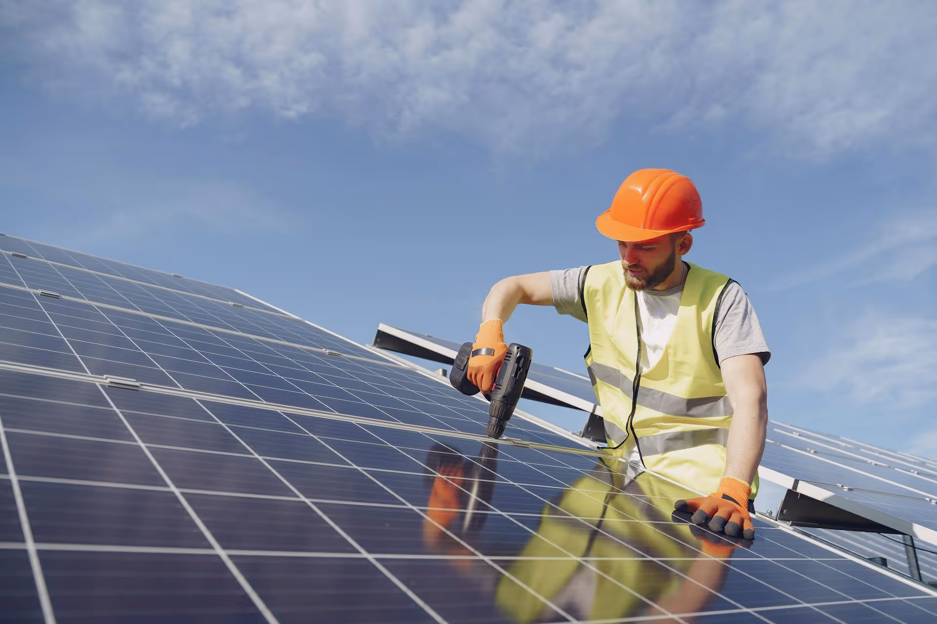Workers repairing solar panel