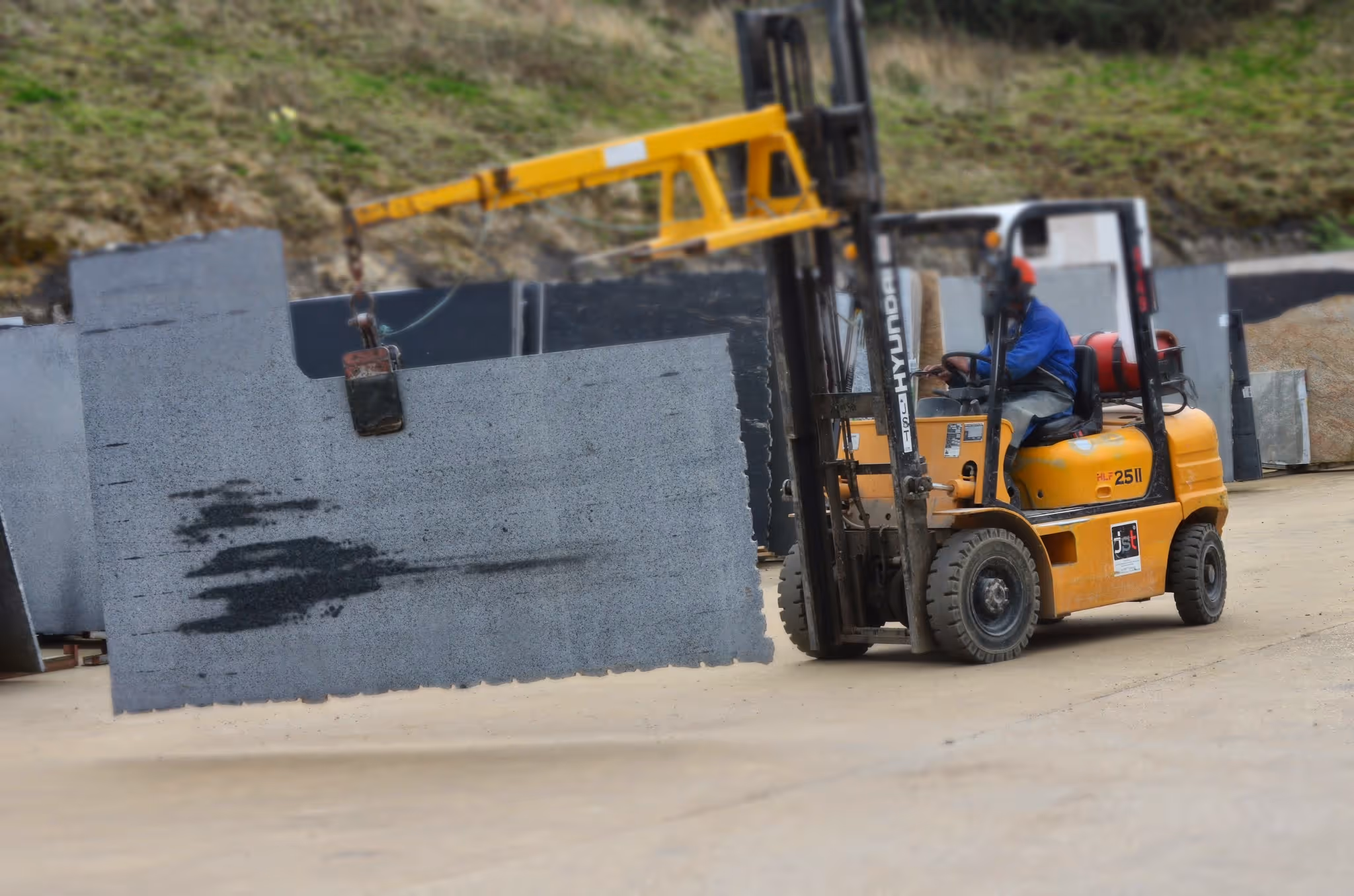 Slab being lifted by a forklift truck