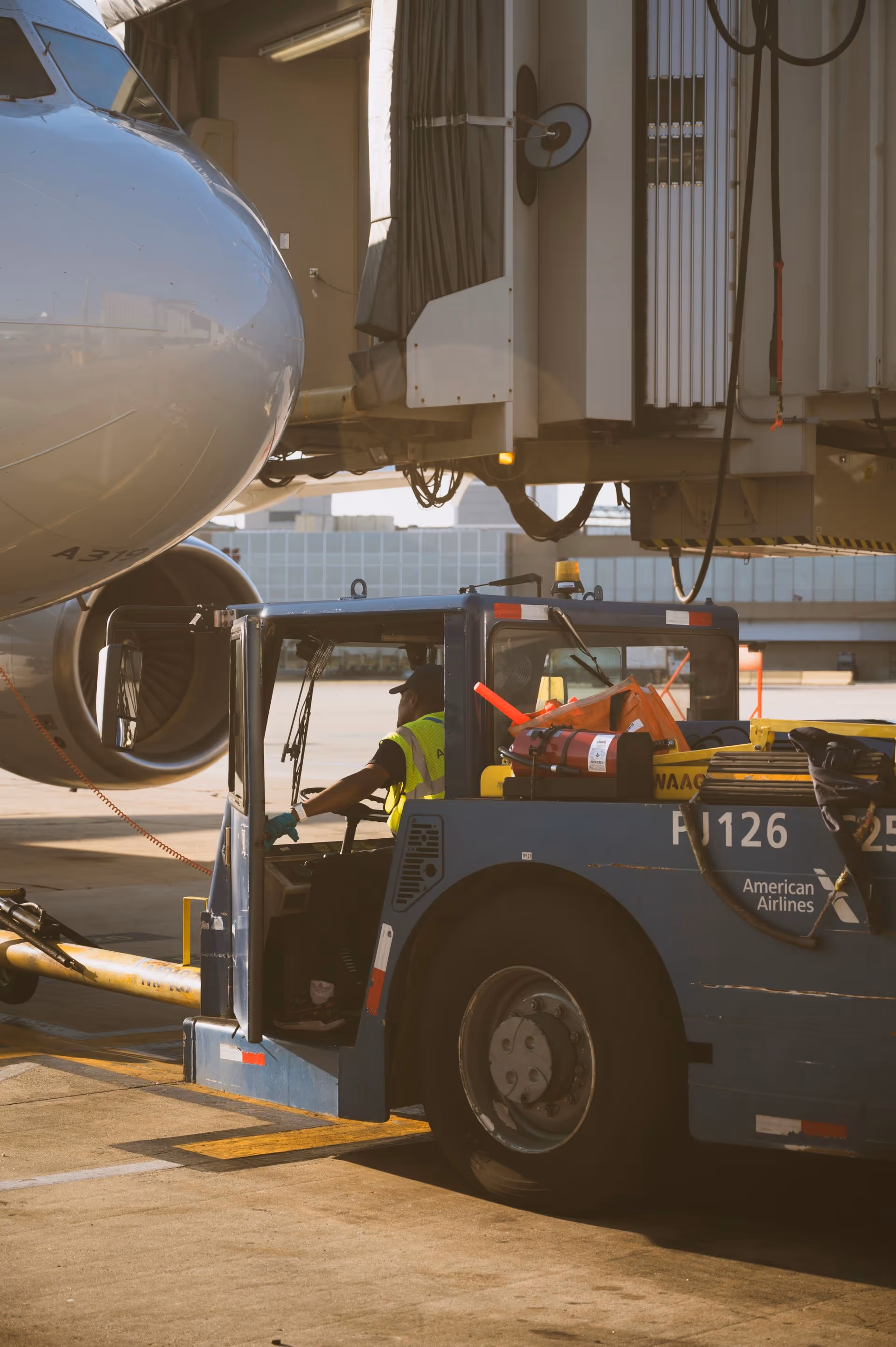 Worker on runway driving machinery