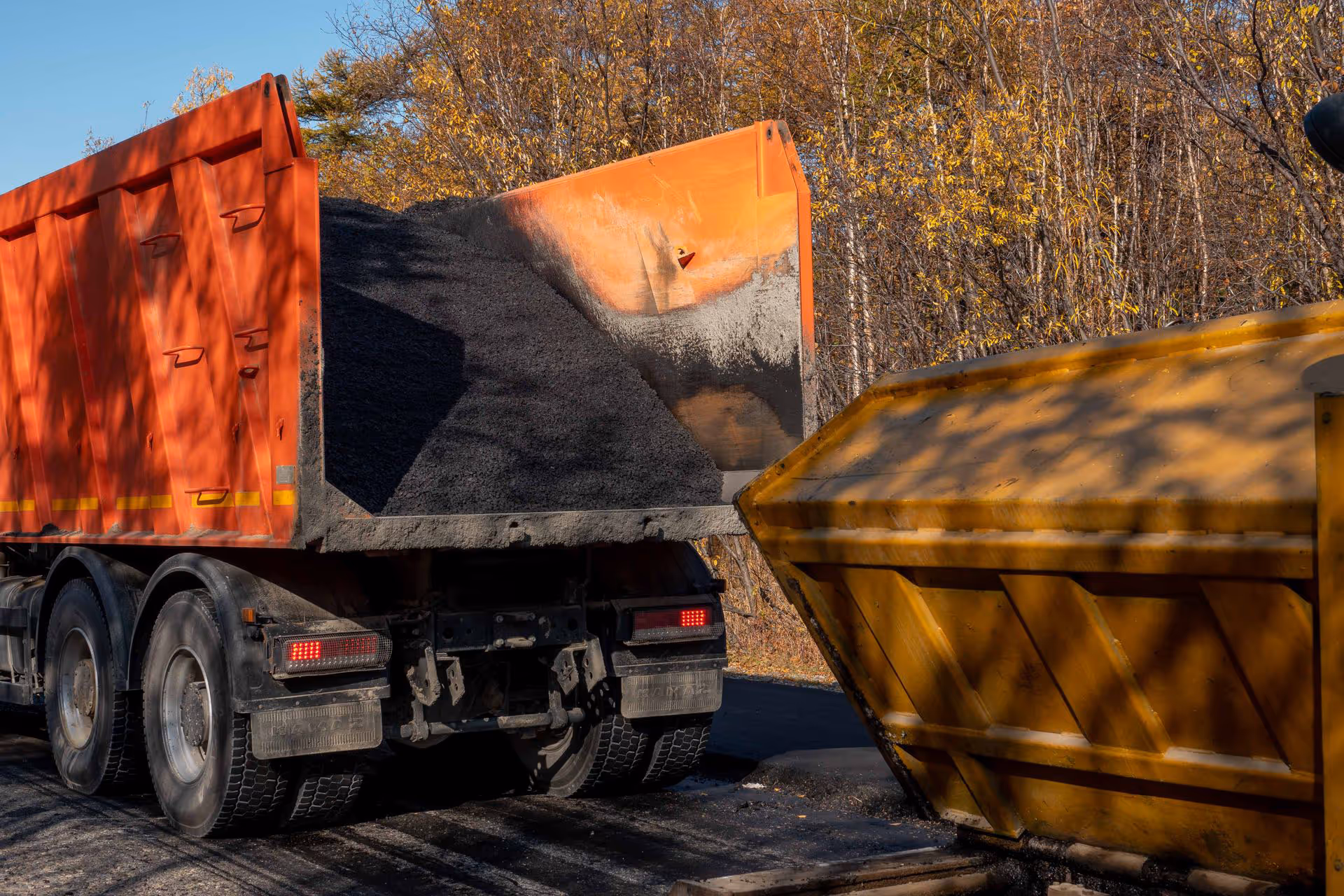 Tarmac ready to be tipped on tipper