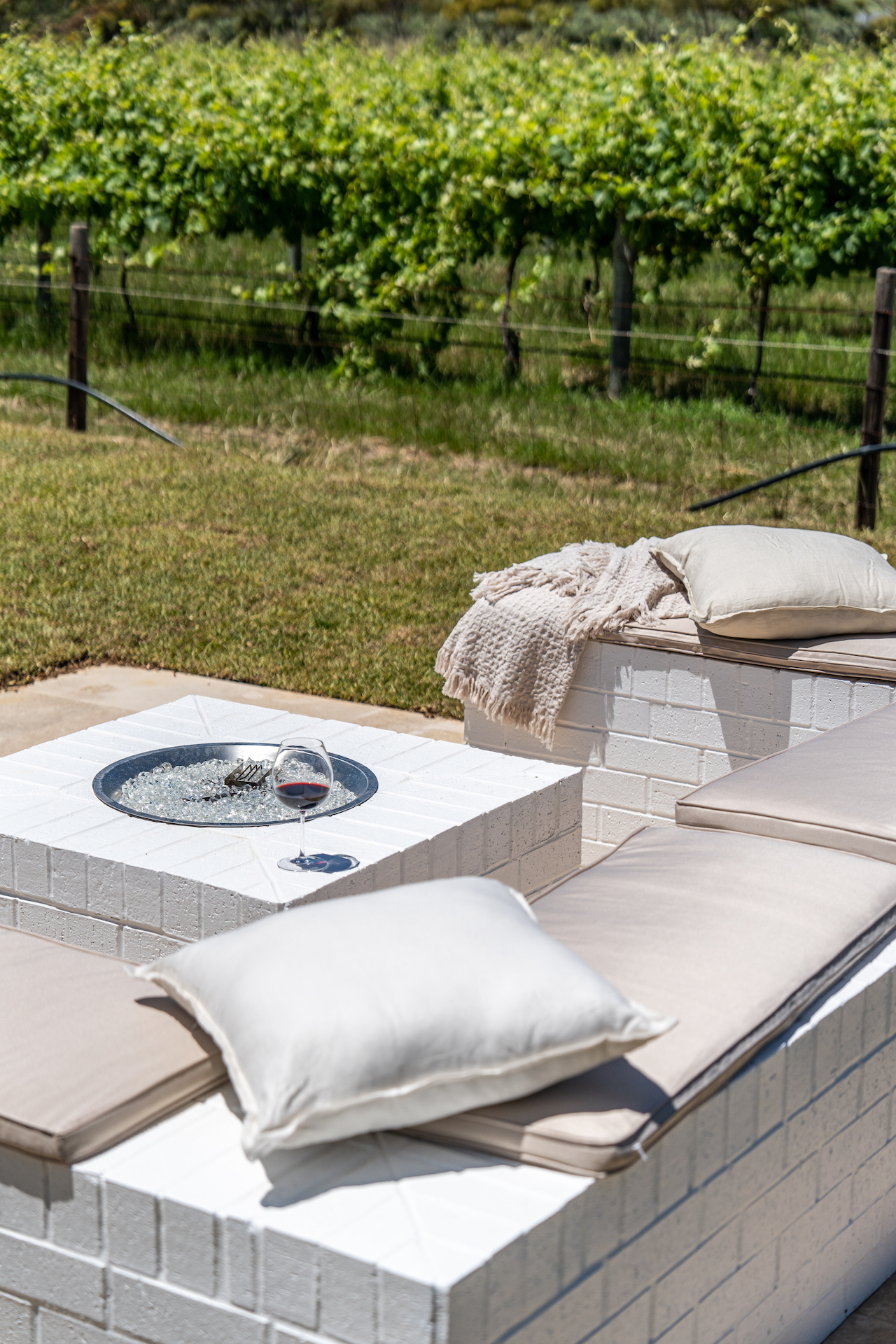 Outdoor gas fire pit with cushions