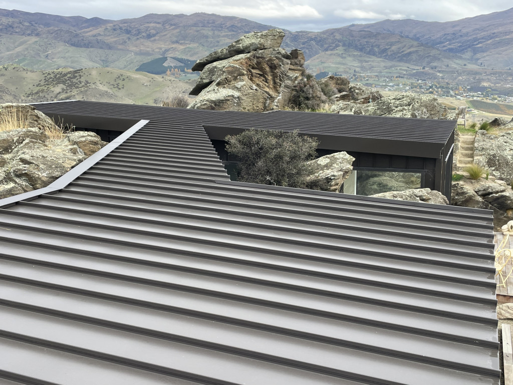 Courtney McDowell,  Attention to Detail Roofing Ltd with Cooper Residence