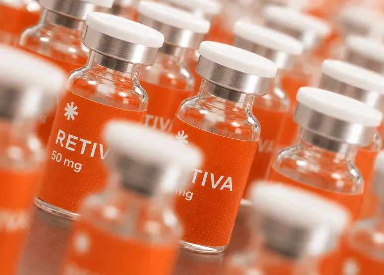 Close-up of small glass vials labeled Retiva 50 mg with white caps arranged in rows.