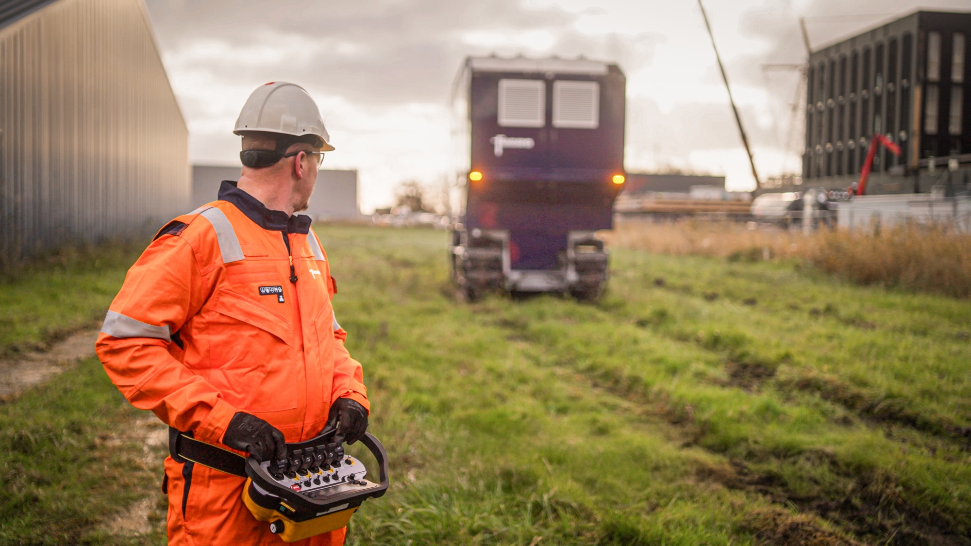 Fugro operator remotely controlling an Electric Deep Drive CPT rig on site