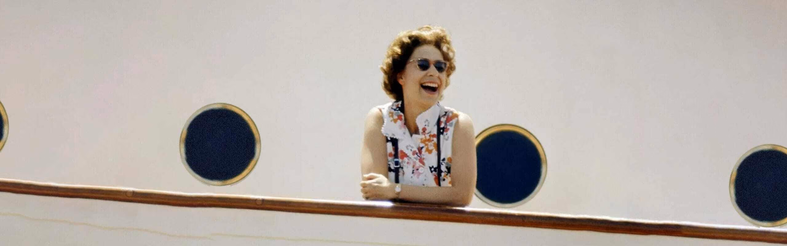 Close up of a woman leaning over the edge of a ferry
