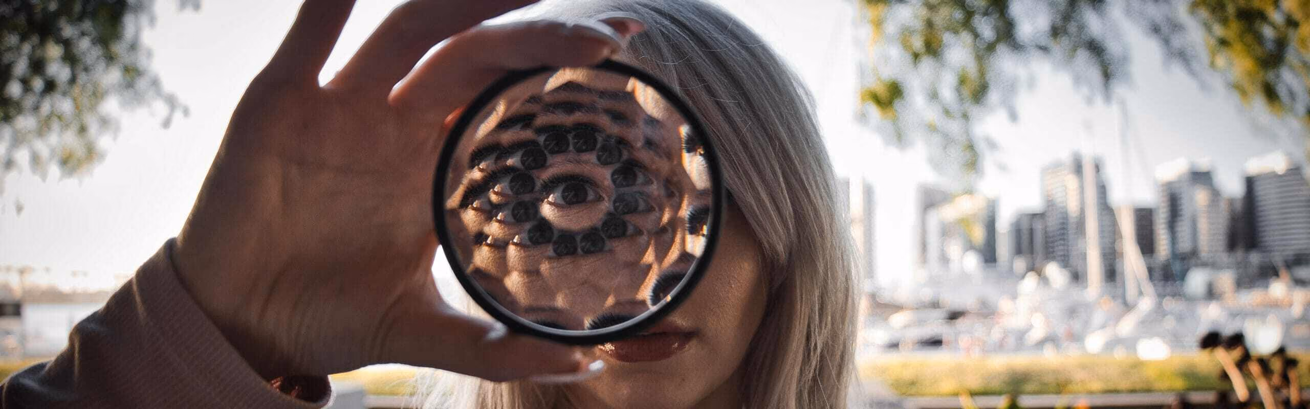 Someone looking through a tryptych causing it to look like they have many eyes