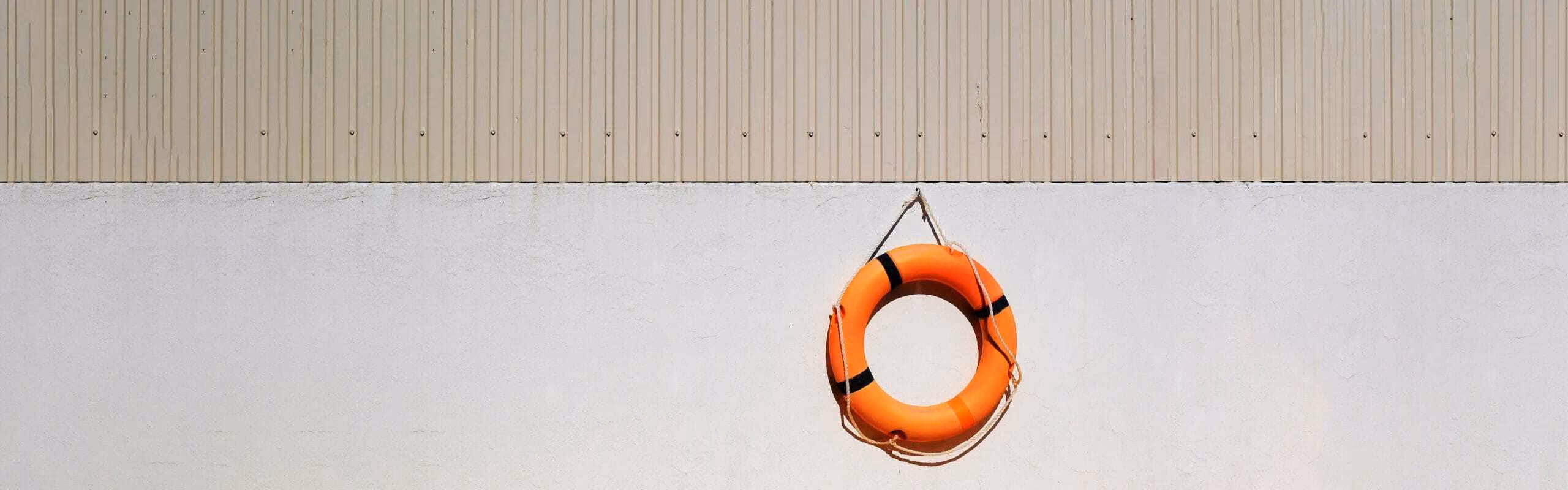 A life ring hanging on a wall
