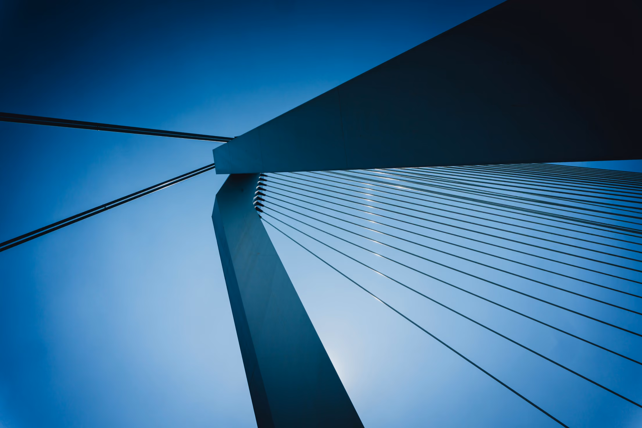 Close up image of the top of a suspension bridge