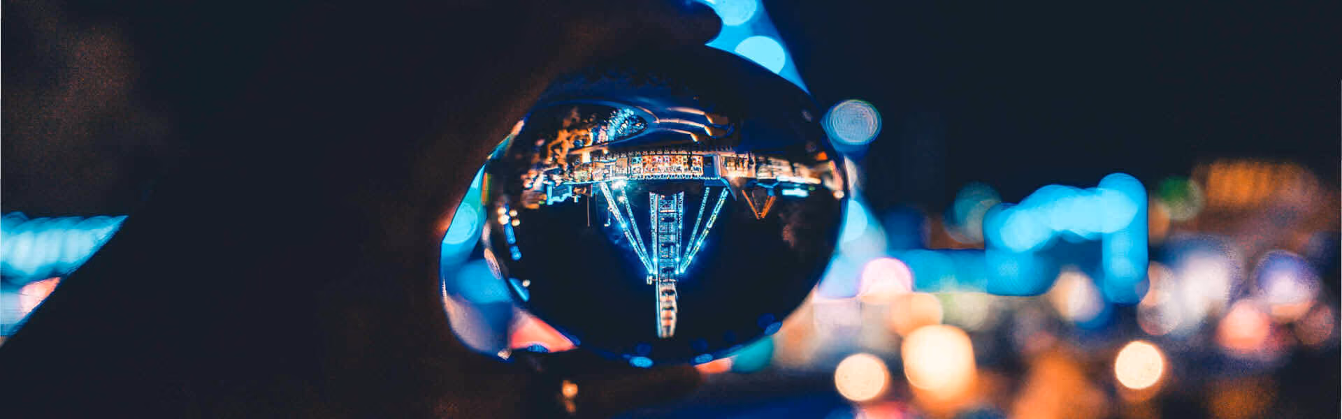 Close up of a reflective ball with party lights in it