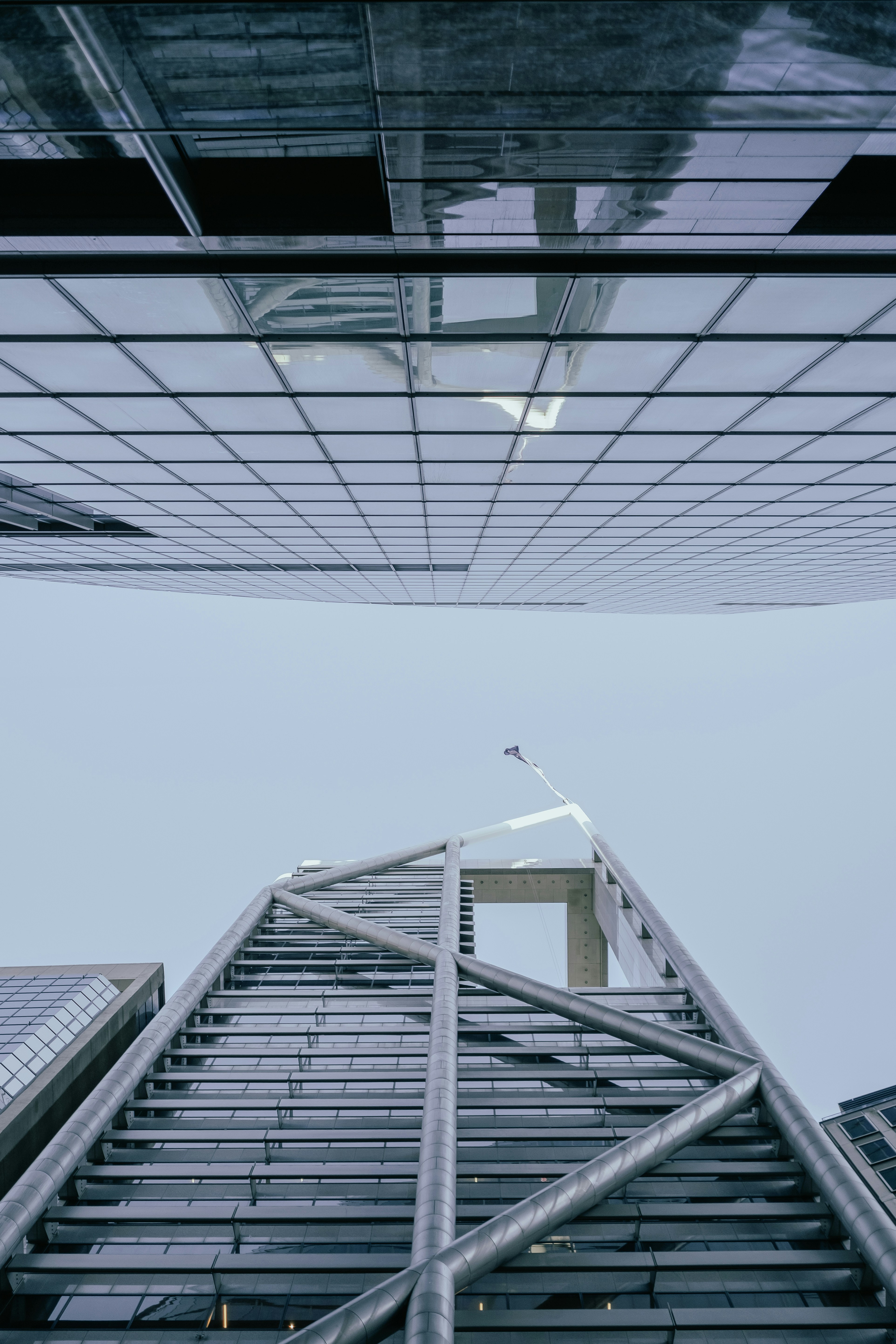View of two mirrored office buildings from below