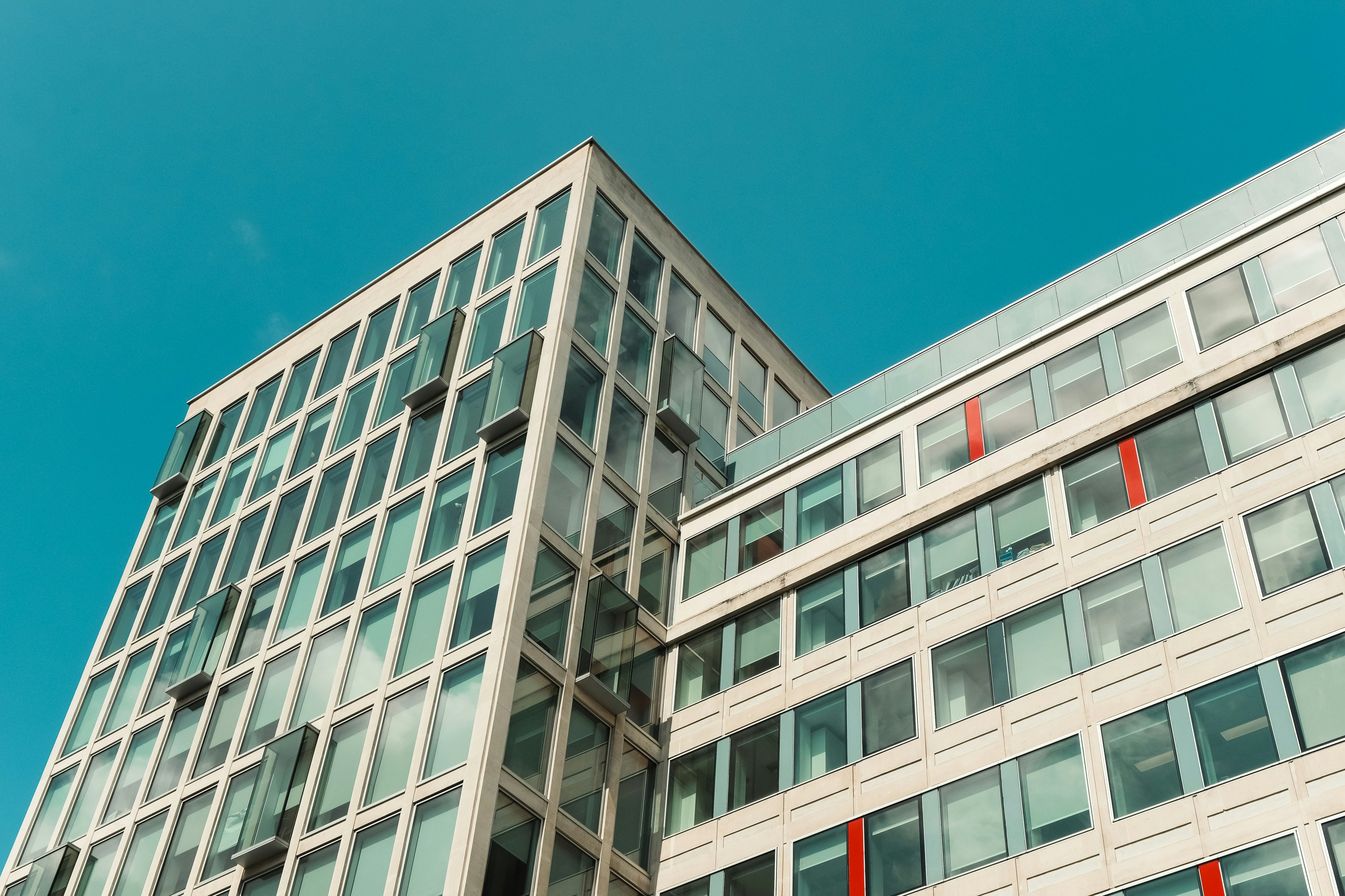 Wide office building set against a blue sky