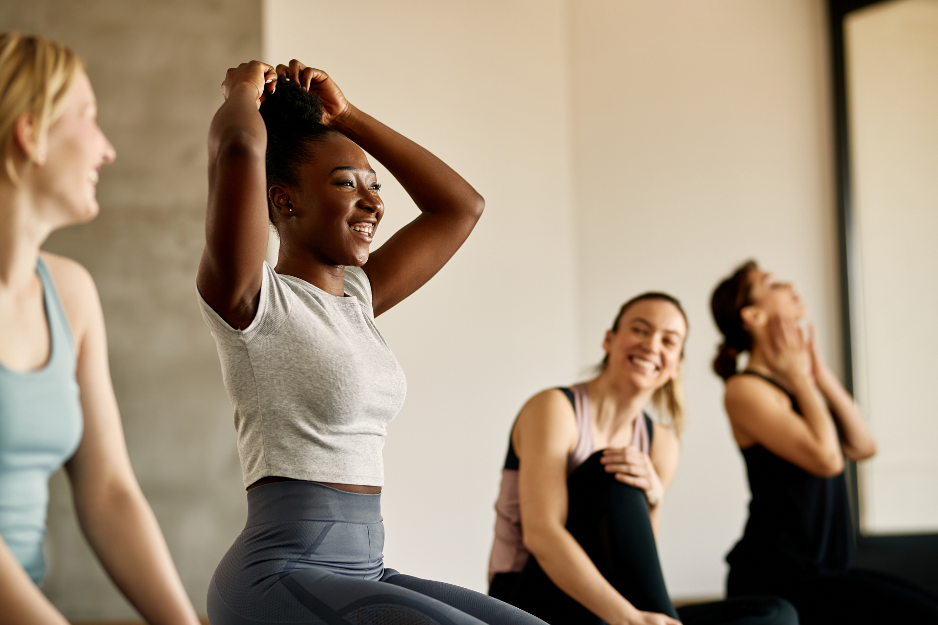 Women smiling in athletic gear stock image