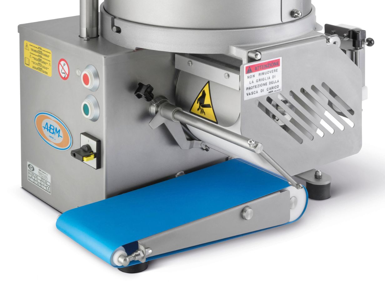 Commercial food slicer machine with blue conveyor belt and safety warning labels.