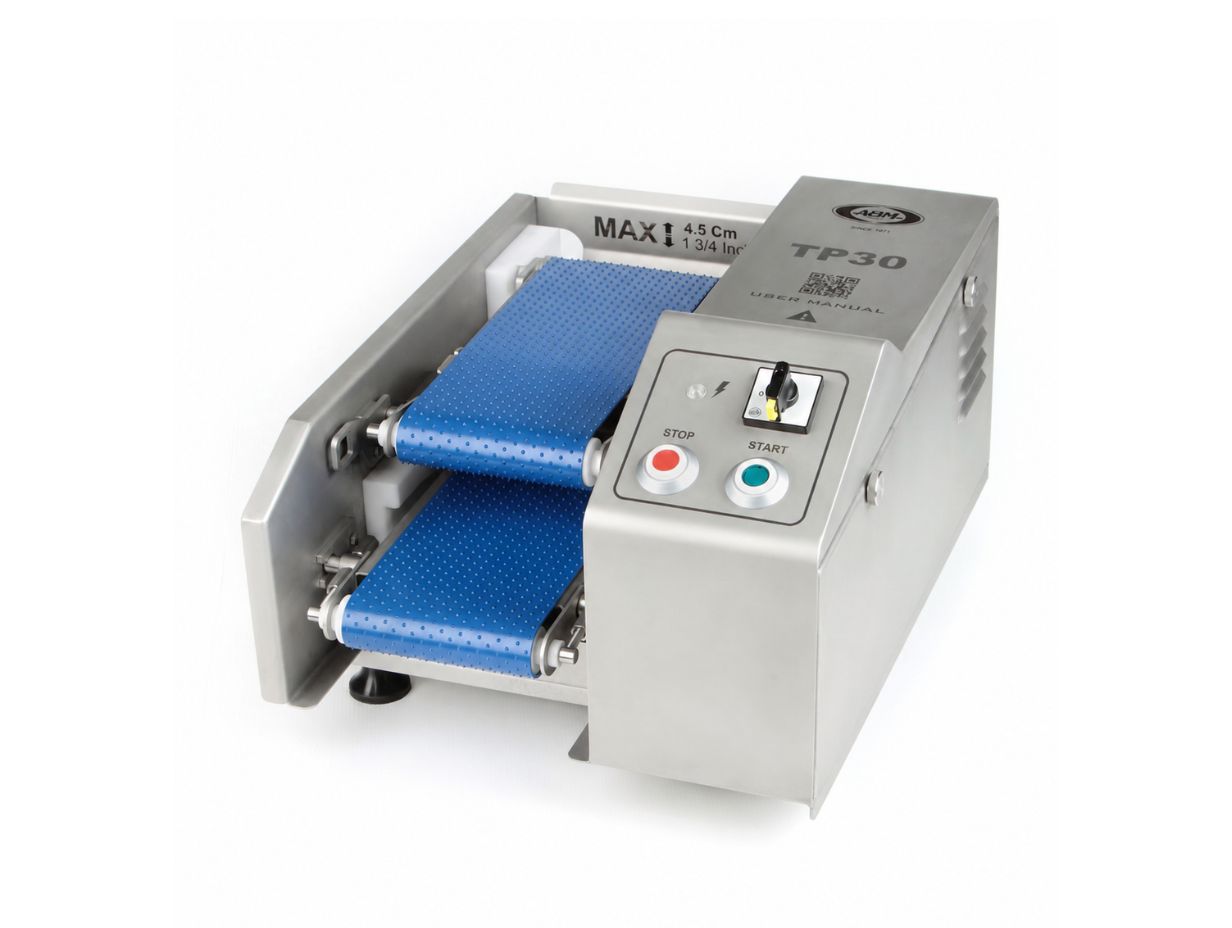 Stainless steel ABM TP30 machine with blue dual conveyor belts and start, stop buttons.