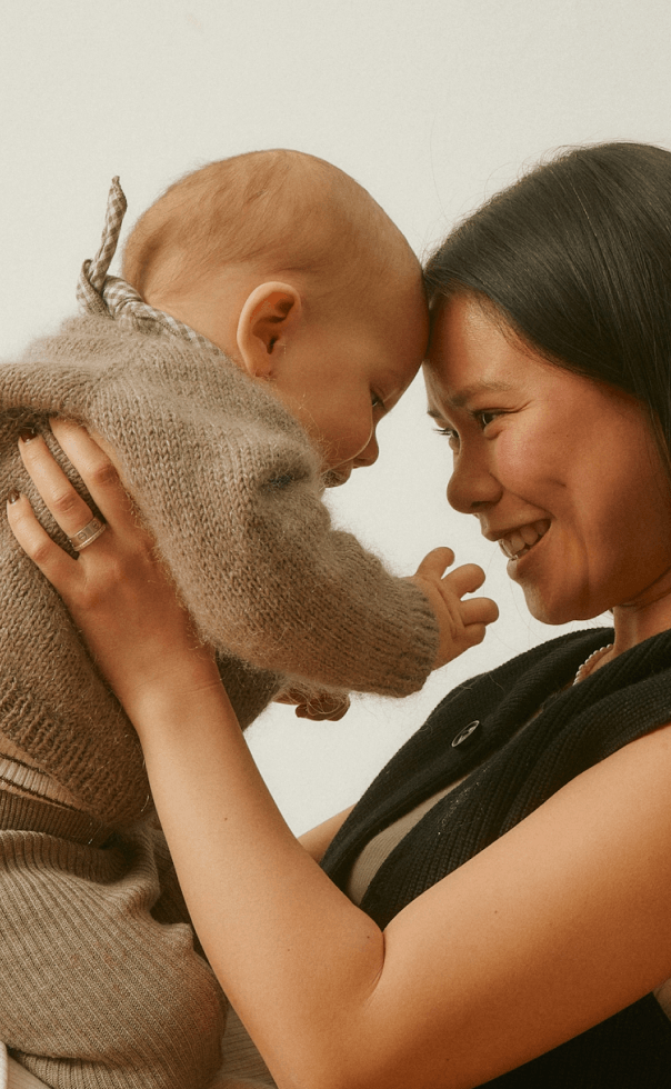 Parent holding a baby close
