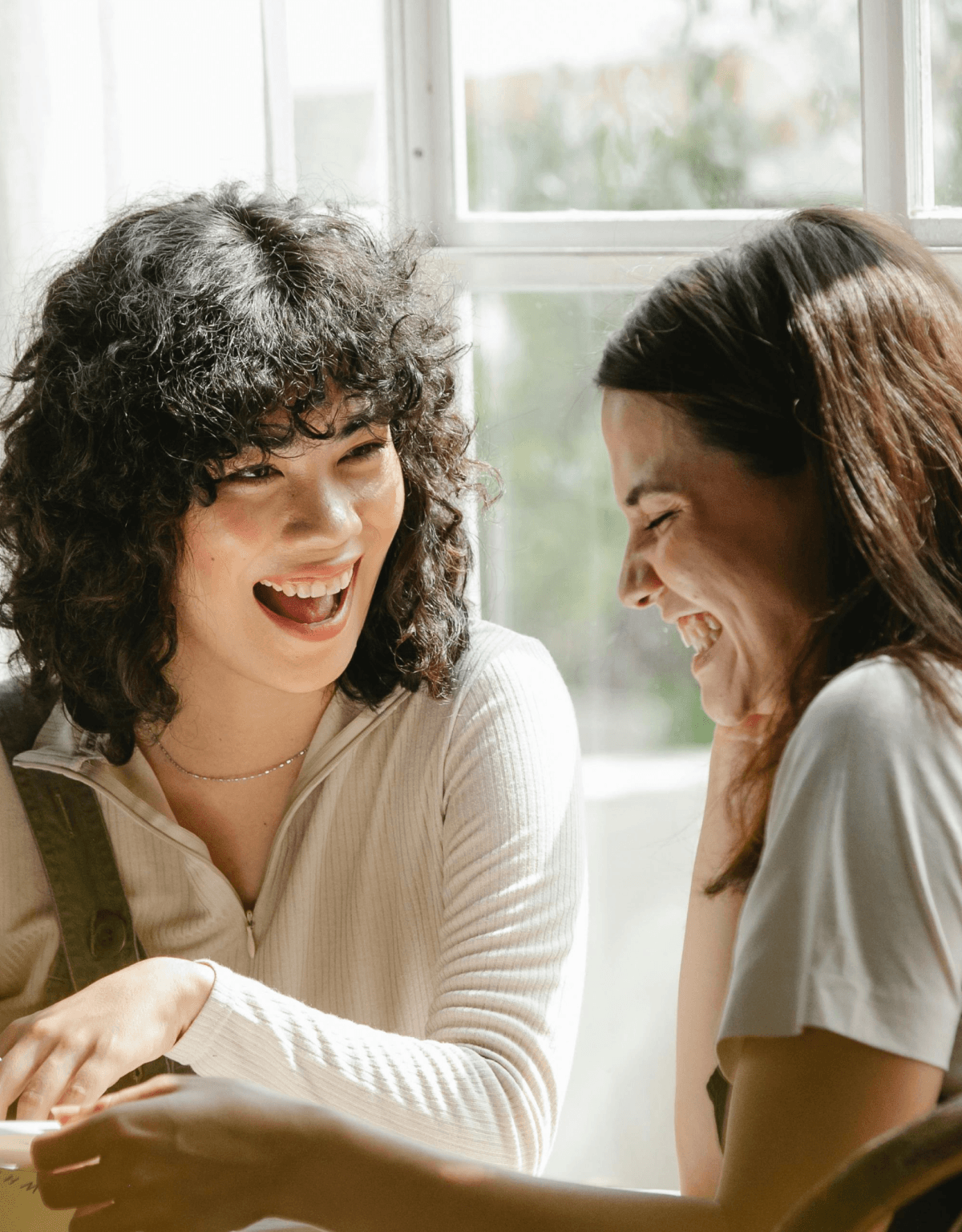 Two women sitting together in conversation