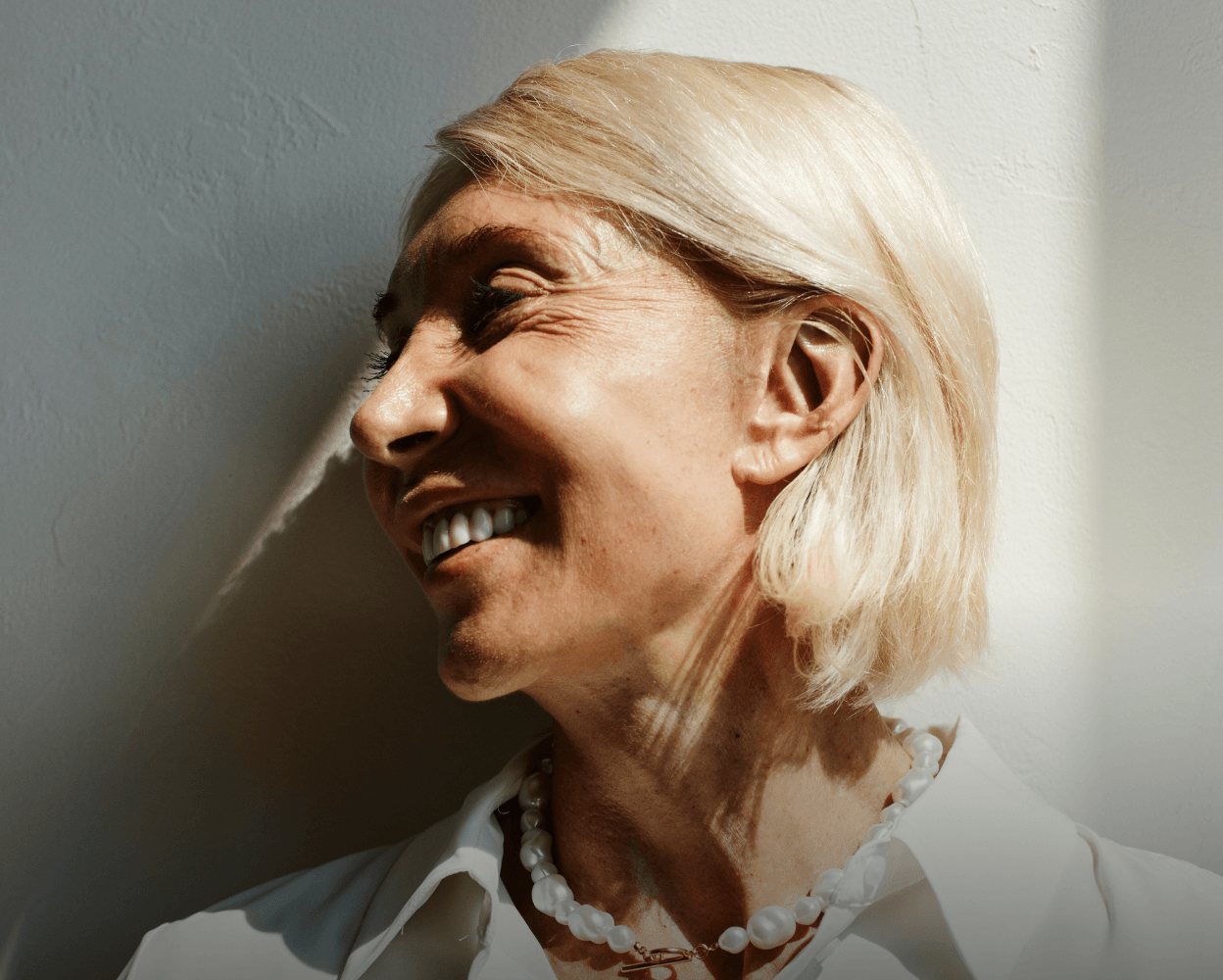 Smiling person looking upward