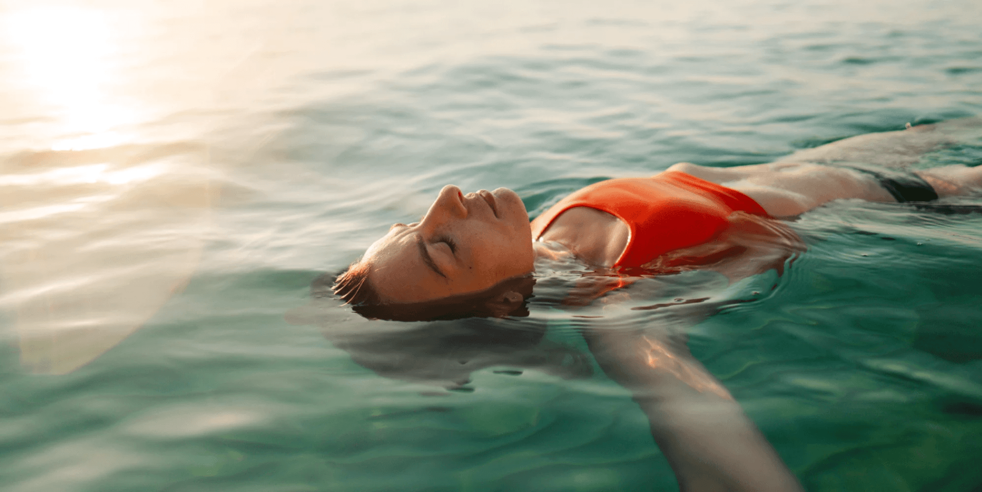Person floating peacefully in the water