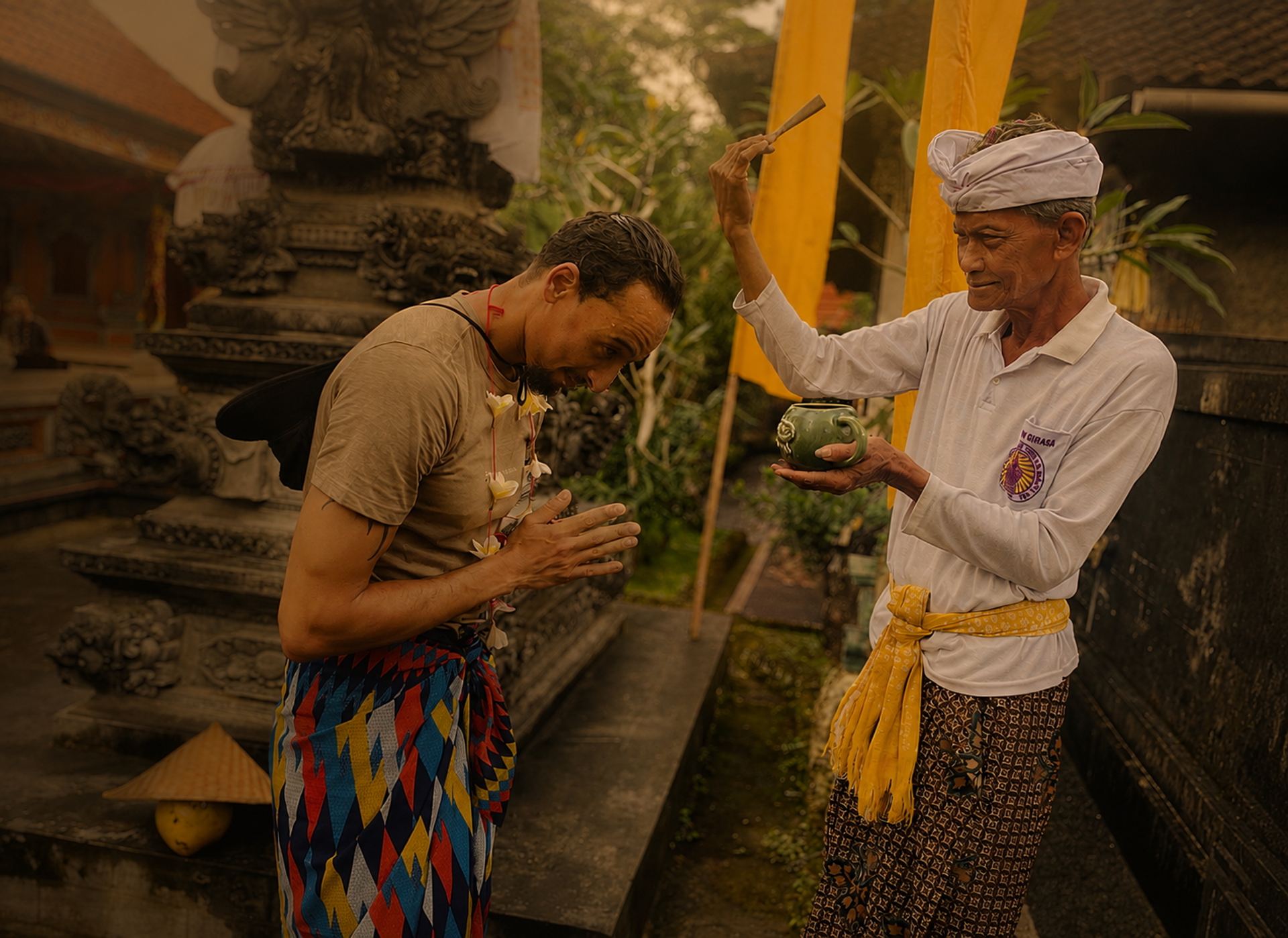A traveler receiving a traditional blessing in Bali.