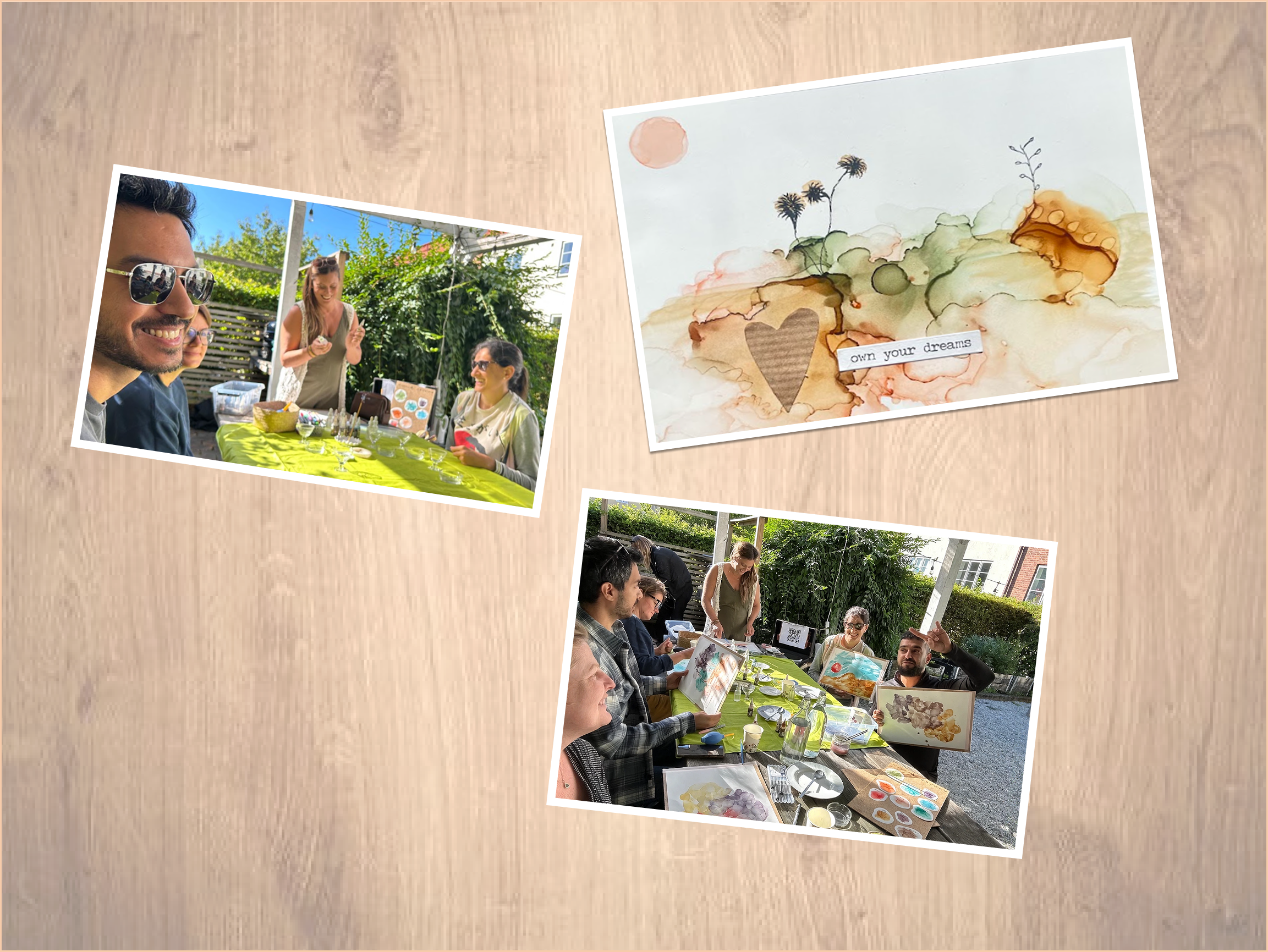 Collage of three photos on a wooden background: two photos show people at an outdoor green-tablecloth-covered table with art supplies, painting and displaying watercolor artworks, one photo shows a watercolor painting with a heart and flowers and the text 'own your dreams'.