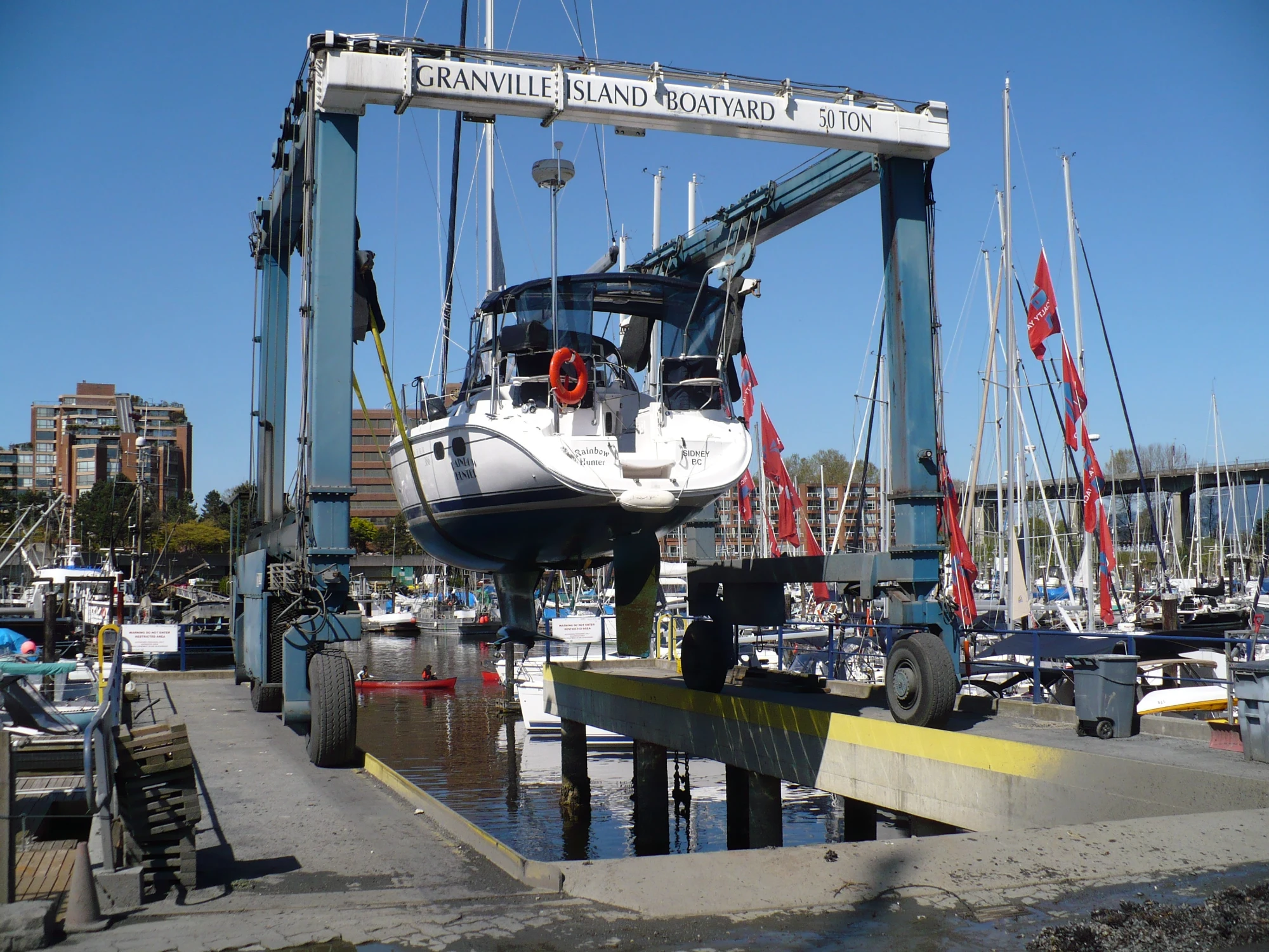 Granville Island Boatyard travel lift hauling vessel out of False Creek Vancouver