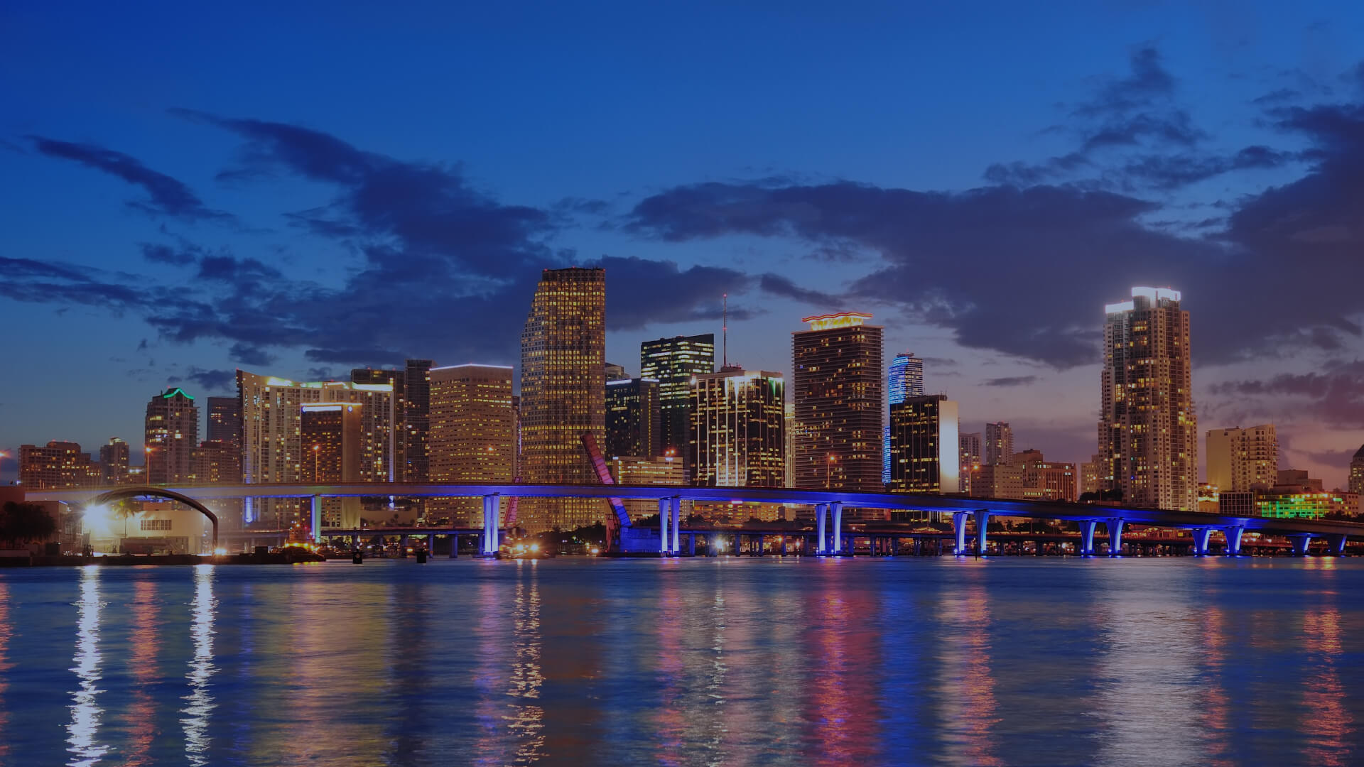 City skyline at dusk representing AGB Insurance's presence protecting families and businesses across Florida