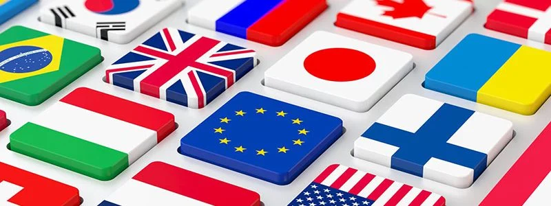 3D tiles of various national flags including the UK, Japan, EU, Finland, and the USA.