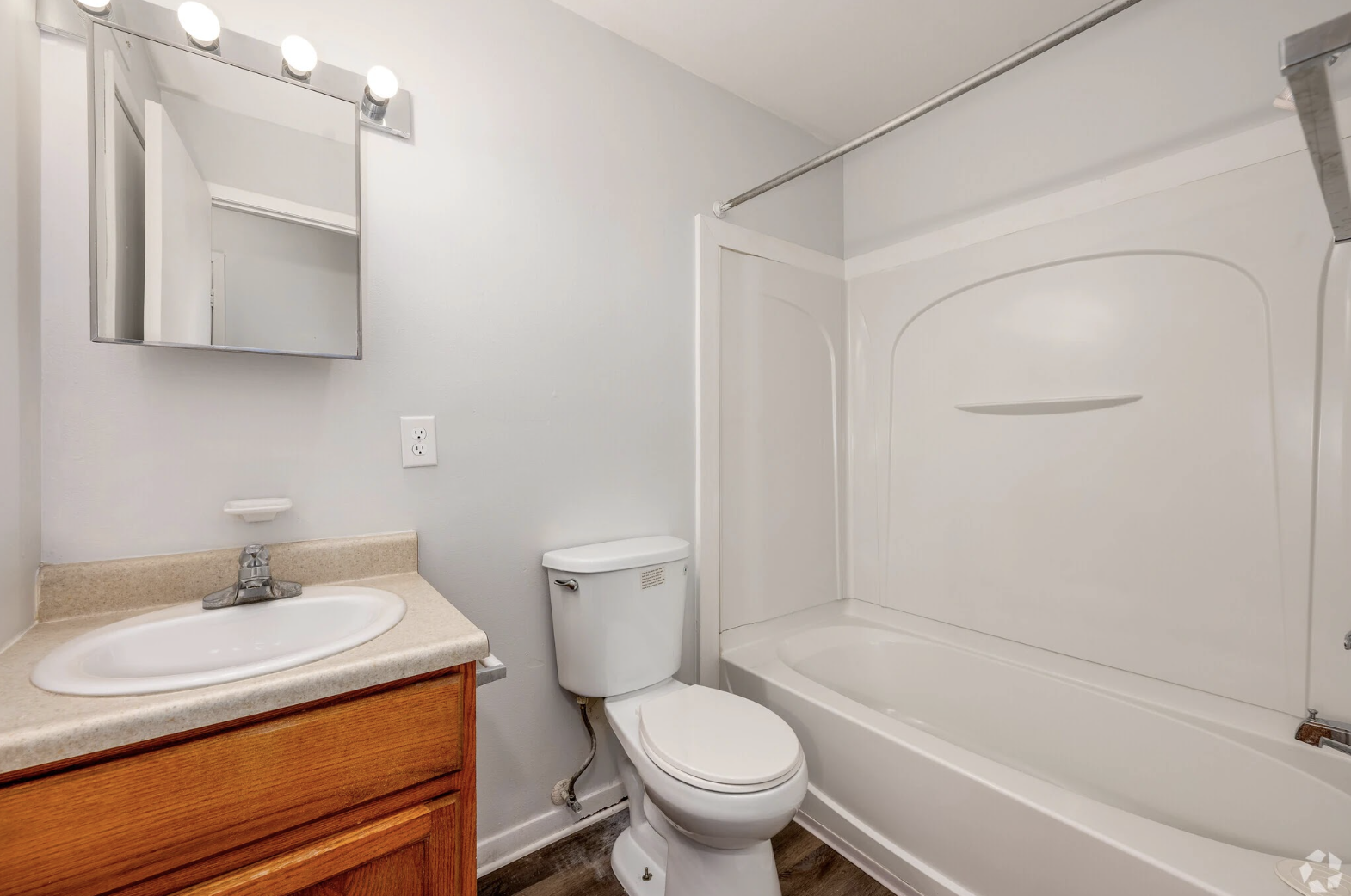 Bathroom with brown cabinets