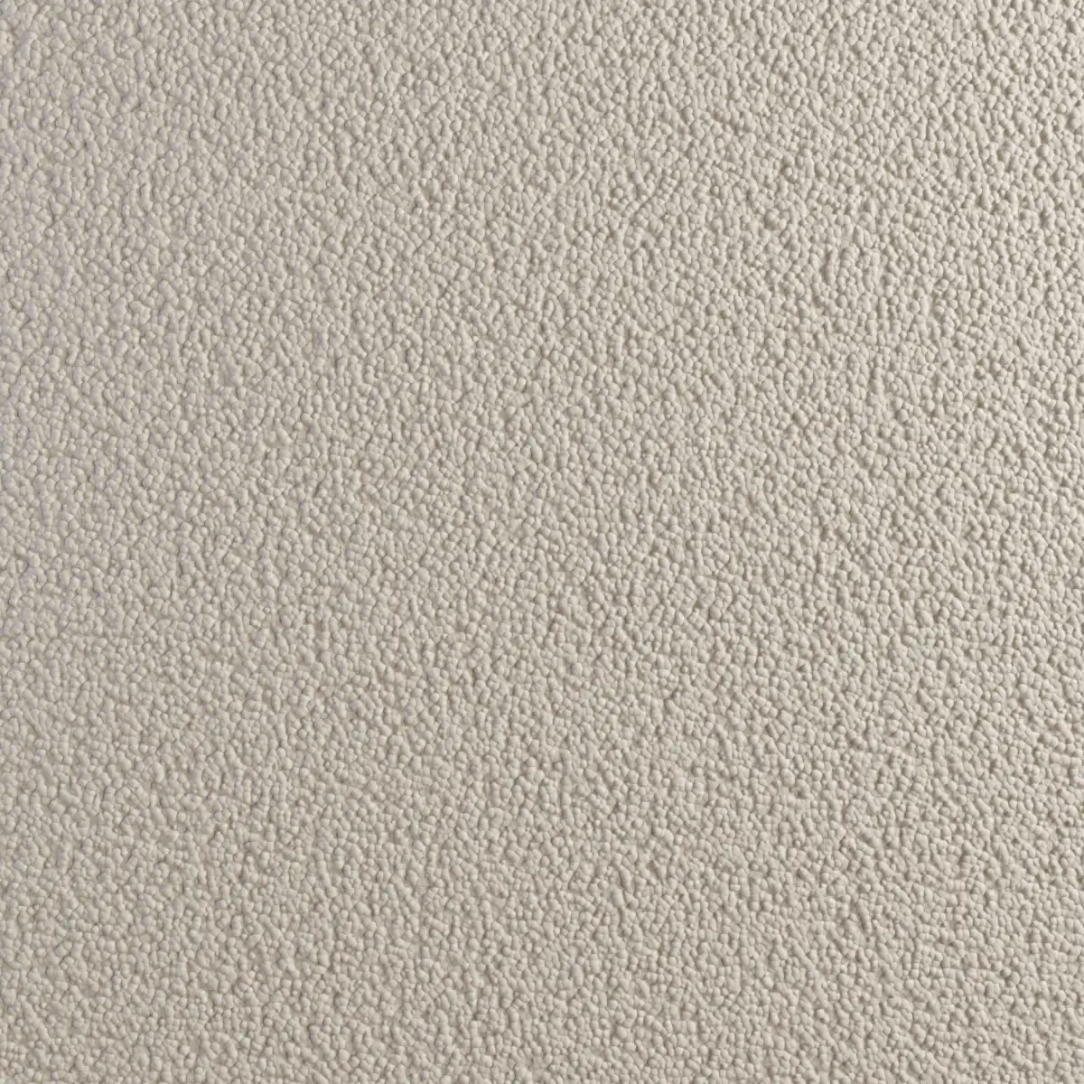 Decoratief pleisterwerk en stopverf met een kiezelstructuur.
