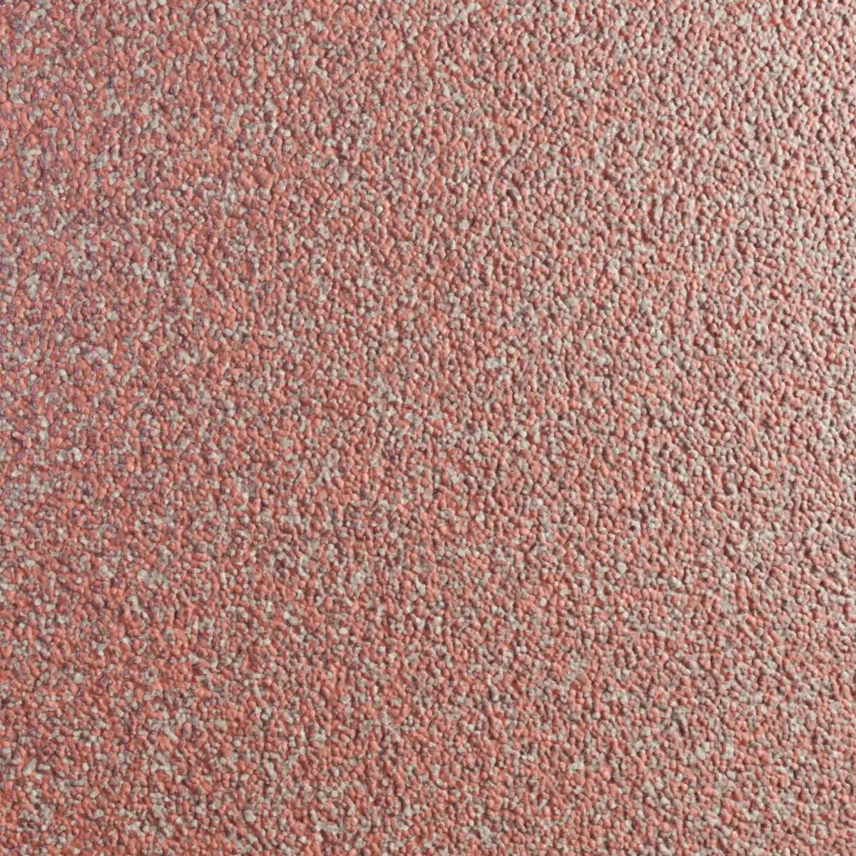 De muur is bedekt met mozaïeken, waarbij rood met lichte accenten de overheersende kleur is.