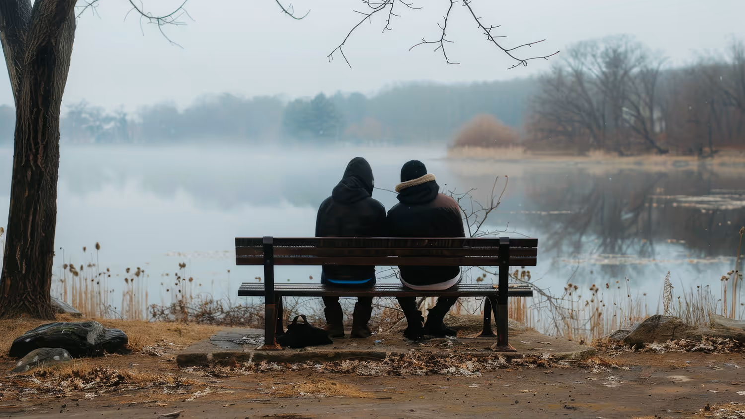 A couple seated together in a calm Plano TX therapy office with Dr. James Bass during a couples counseling session