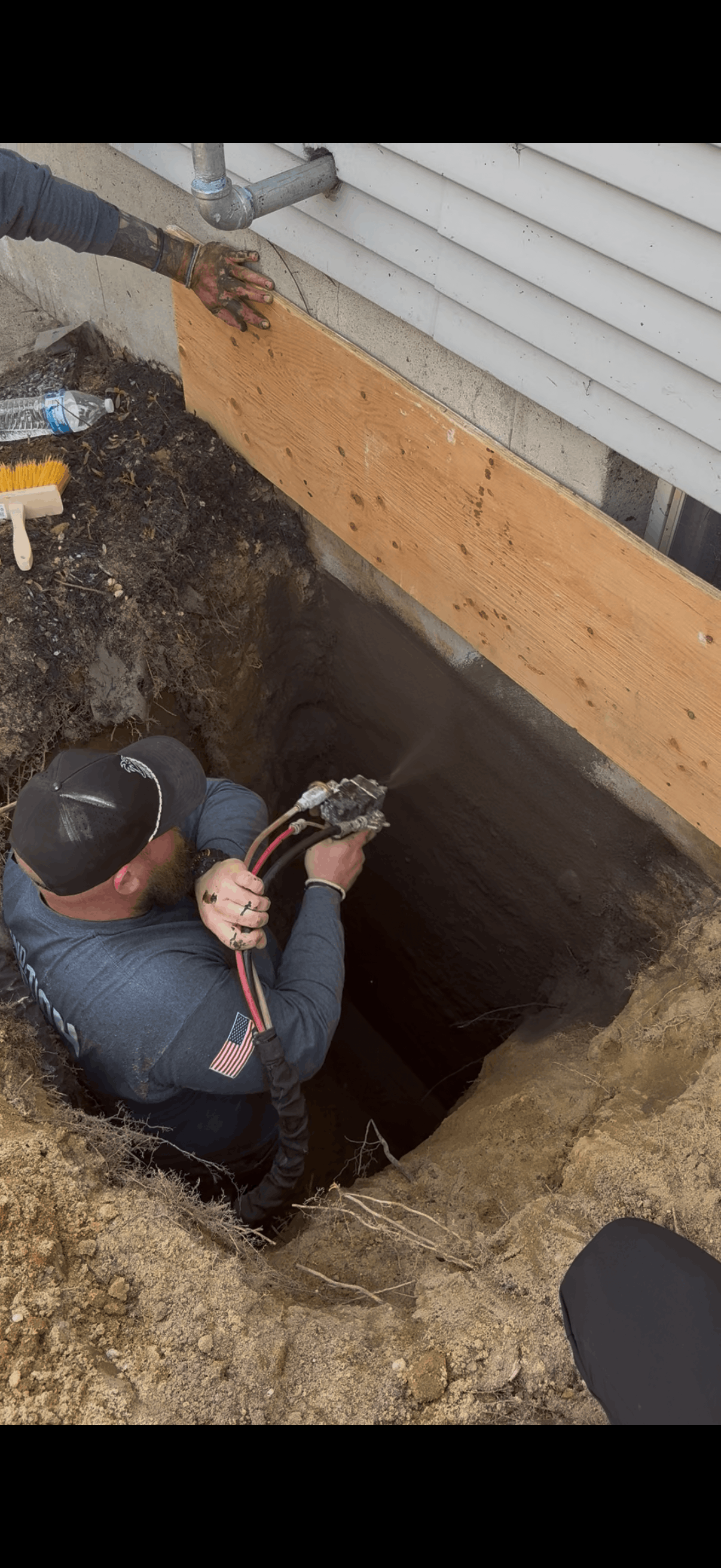 Basement Waterproofing crew working on a Long Island home
