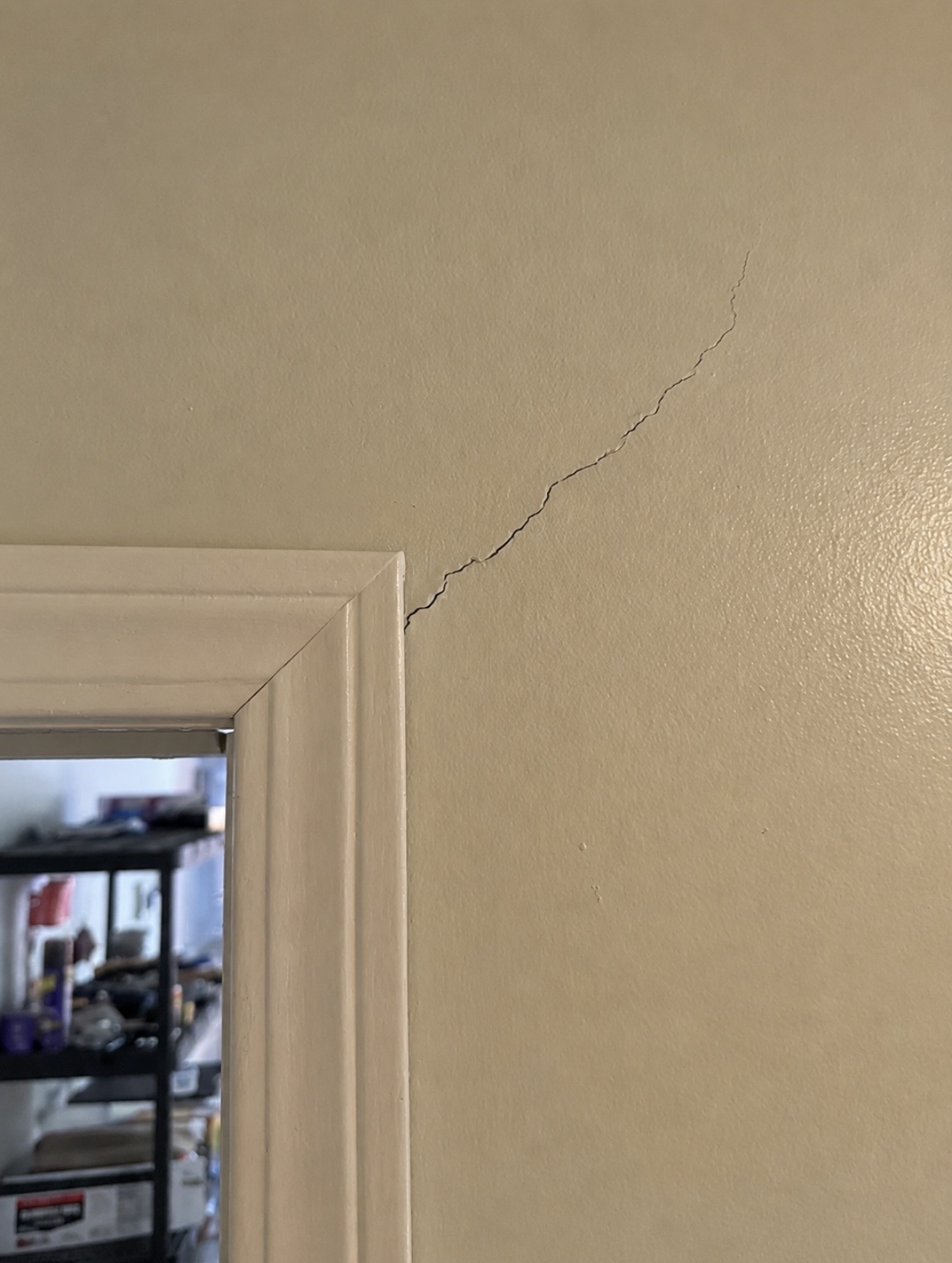 Foundation Crack Repair tech installing wall reinforcement