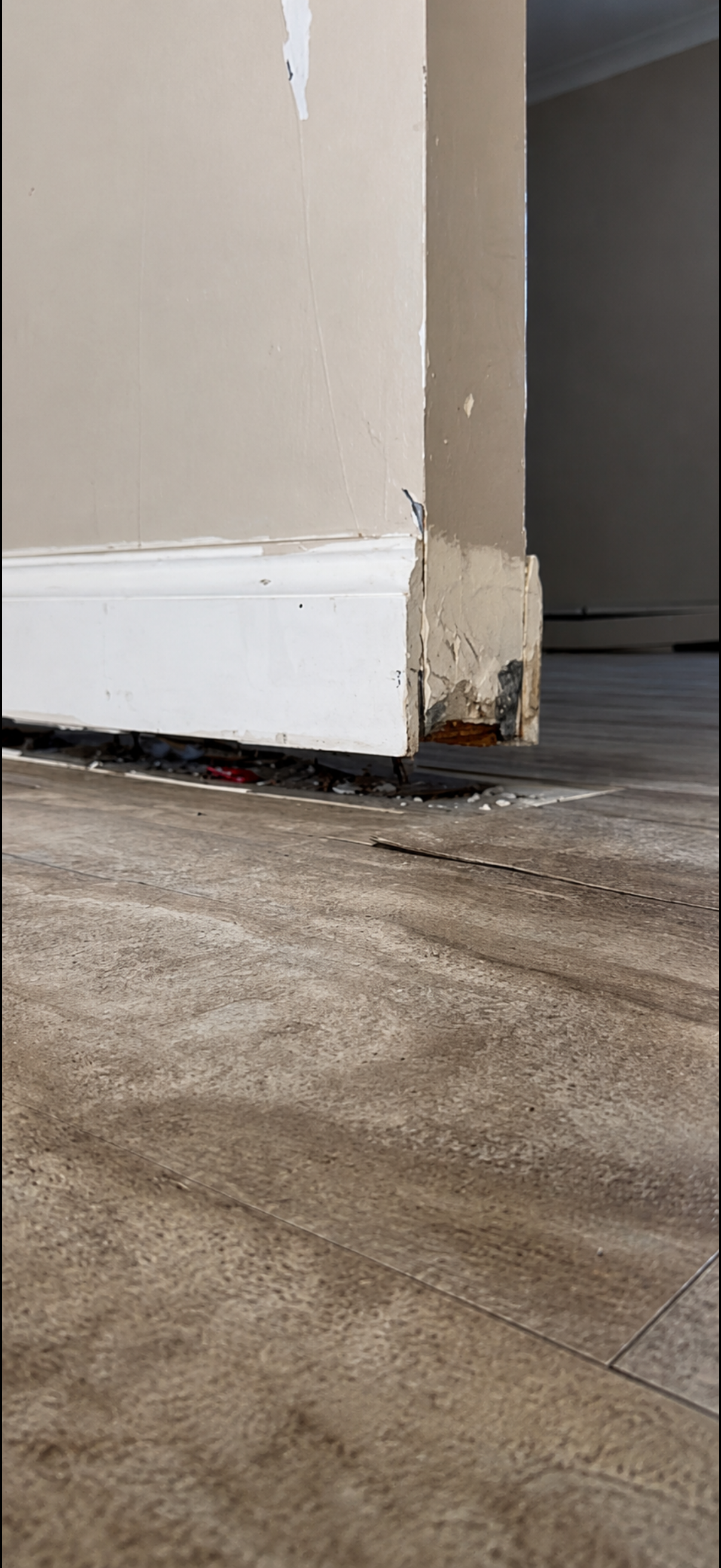 Tech installing a crawl space jack post under sagging joists
