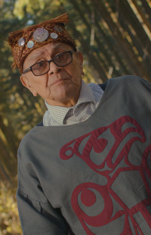 An Indigenous elder in the forest.