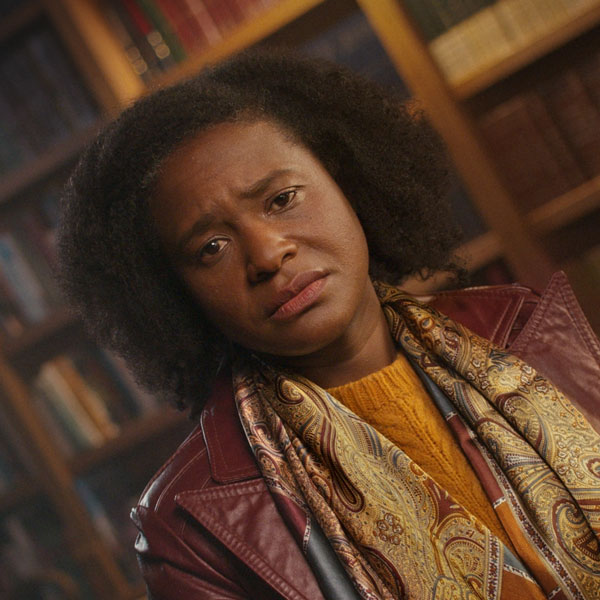 A Black, middle-aged woman at the library.