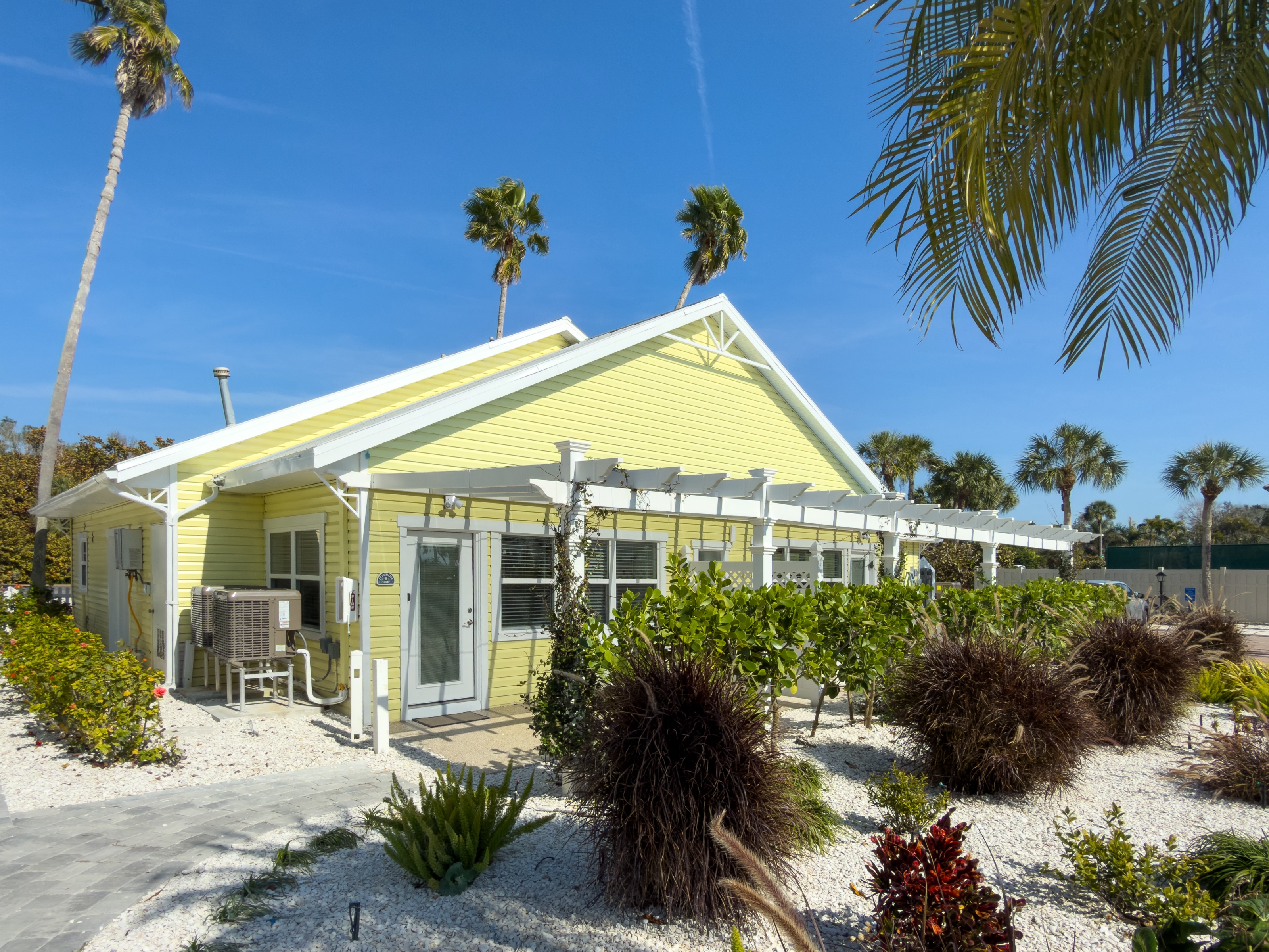 Suite living area with full kitchen at The Wicker Inn, Longboat Key