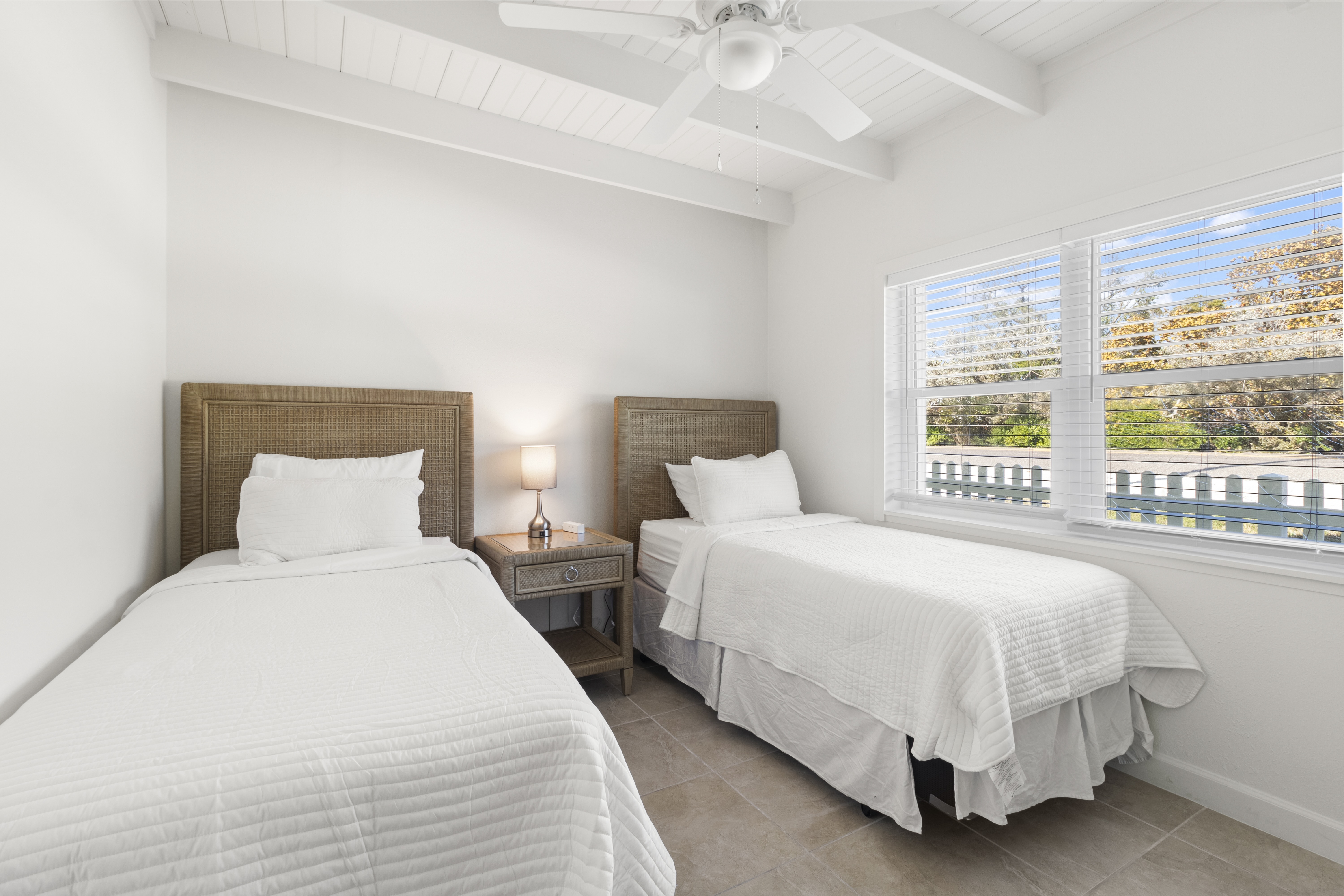 Private porch and heated pool grounds at The Wicker Inn, Longboat Key