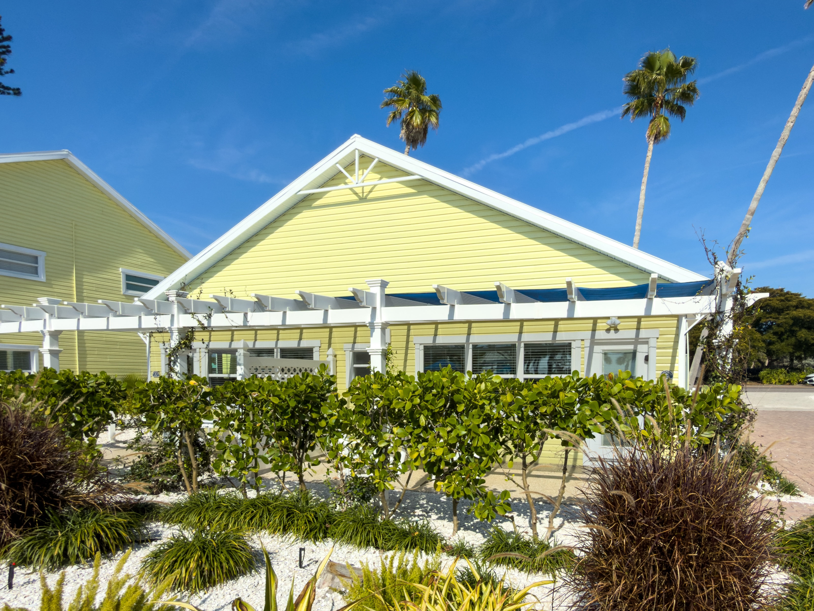 Suite living area with full kitchen at The Wicker Inn, Longboat Key