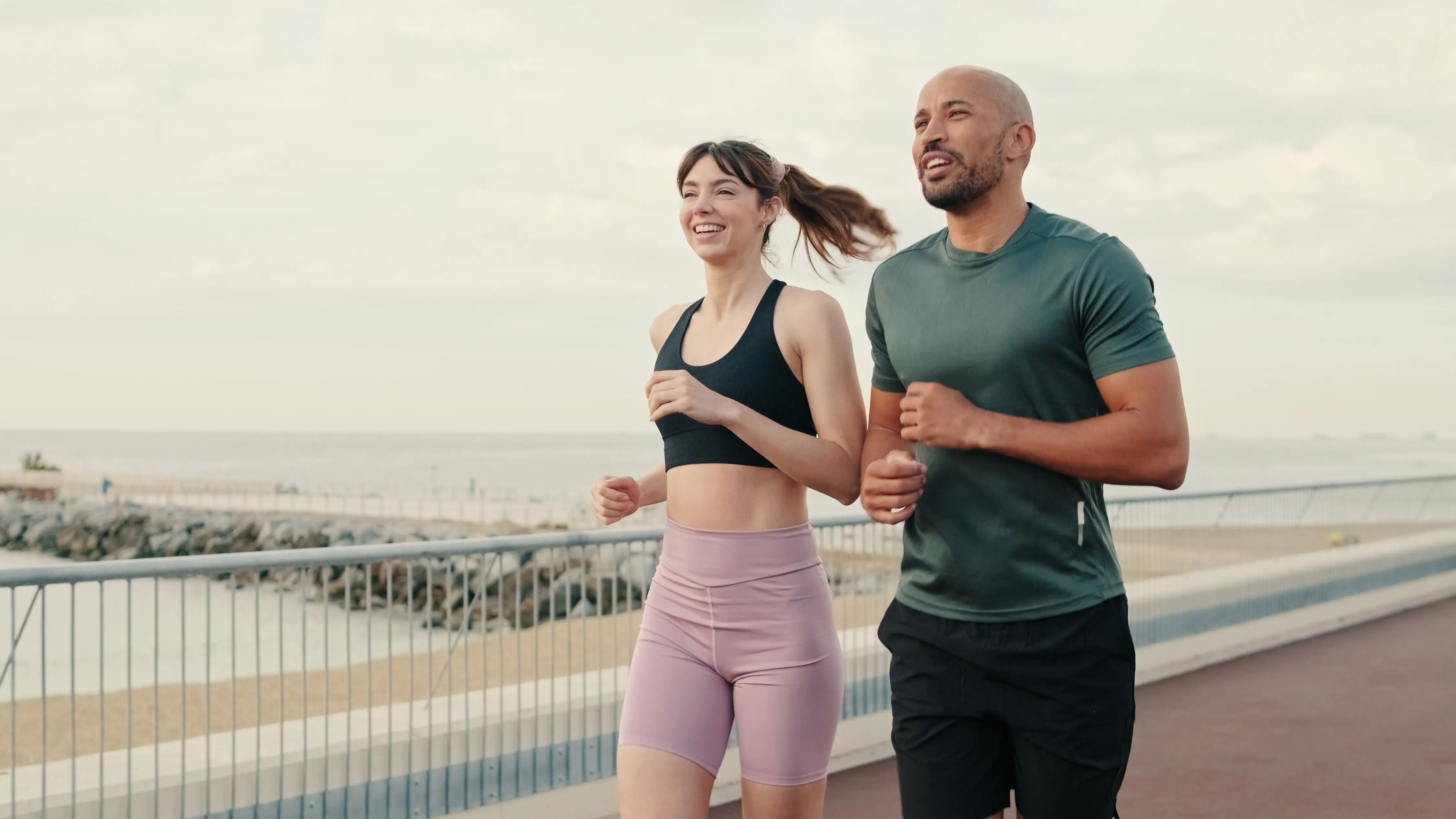 a man and woman in running