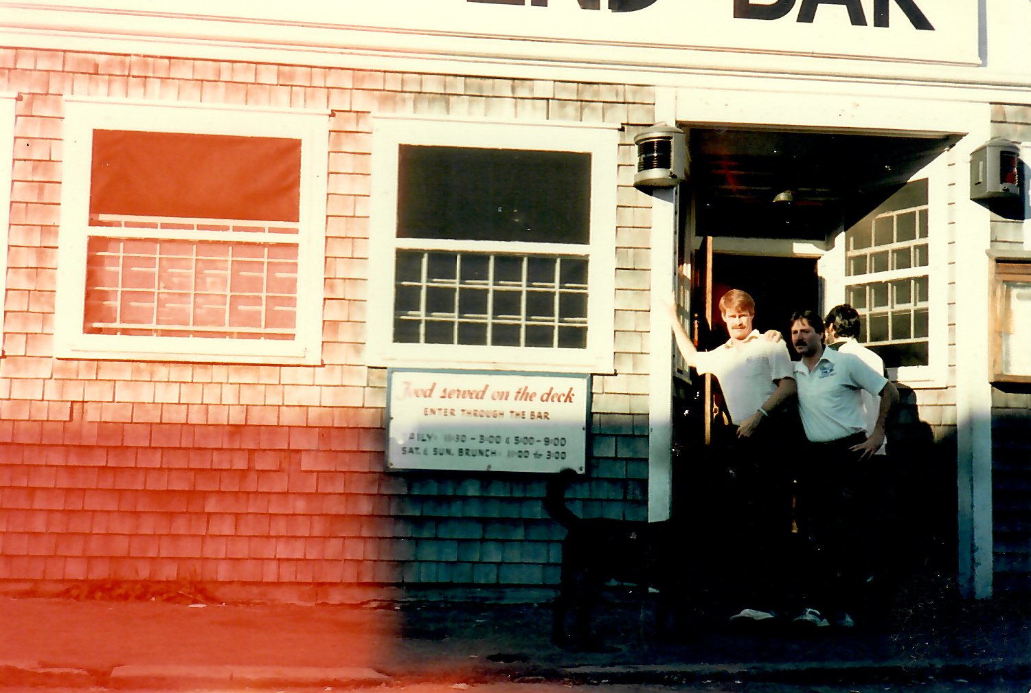 The red clapboard front of The Captain Kidd, seen from the street
