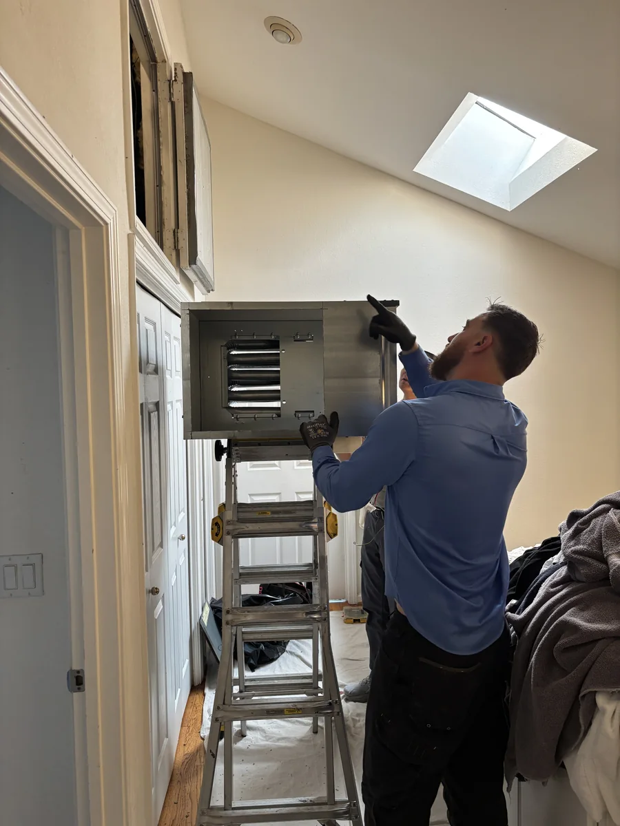 Plug-In Services comfort advisor reviewing a written project plan