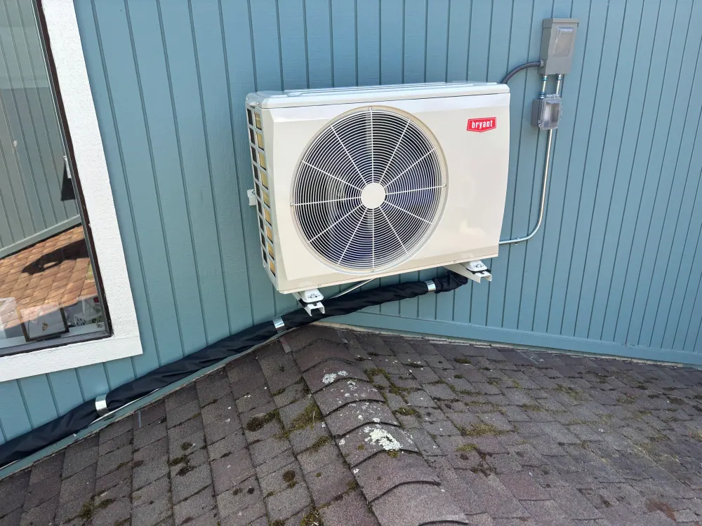 Bryant outdoor heat pump installed on a wall bracket