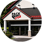 Pack N Stor Self-Storage East Fishkill. Front of Pack N Stor store with white pillars and a red roof peak sign.