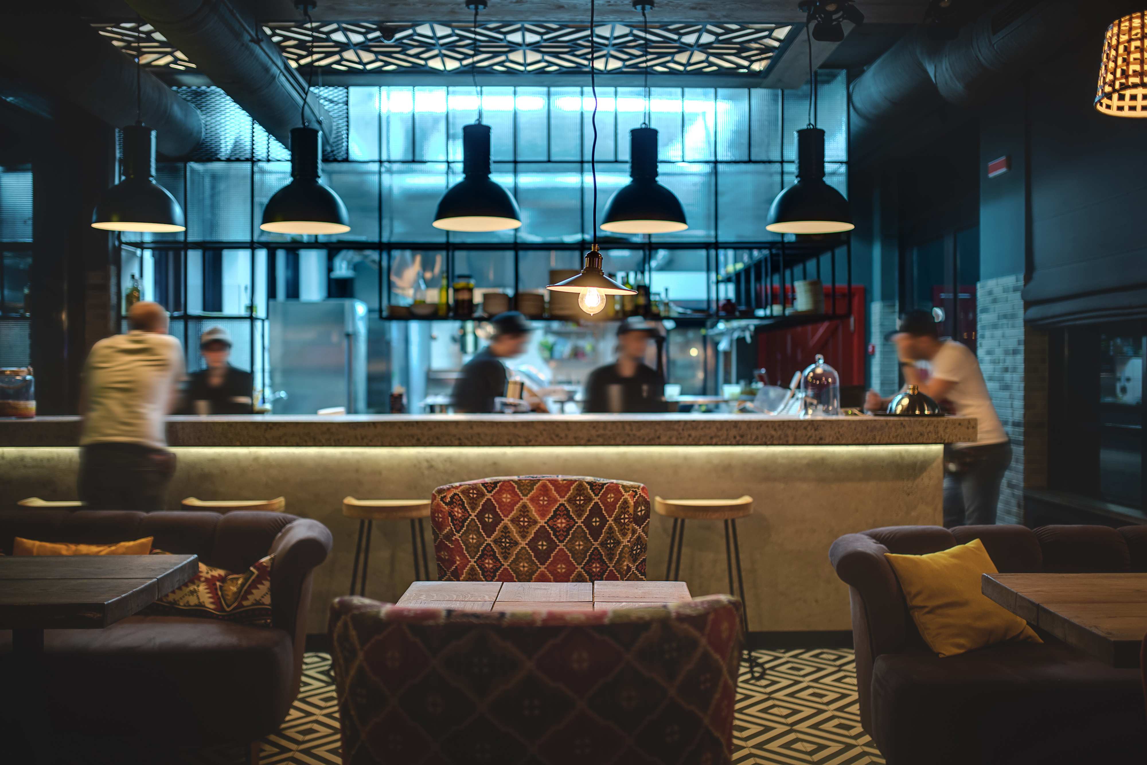 Restaurant lounge with kitchen line visible
