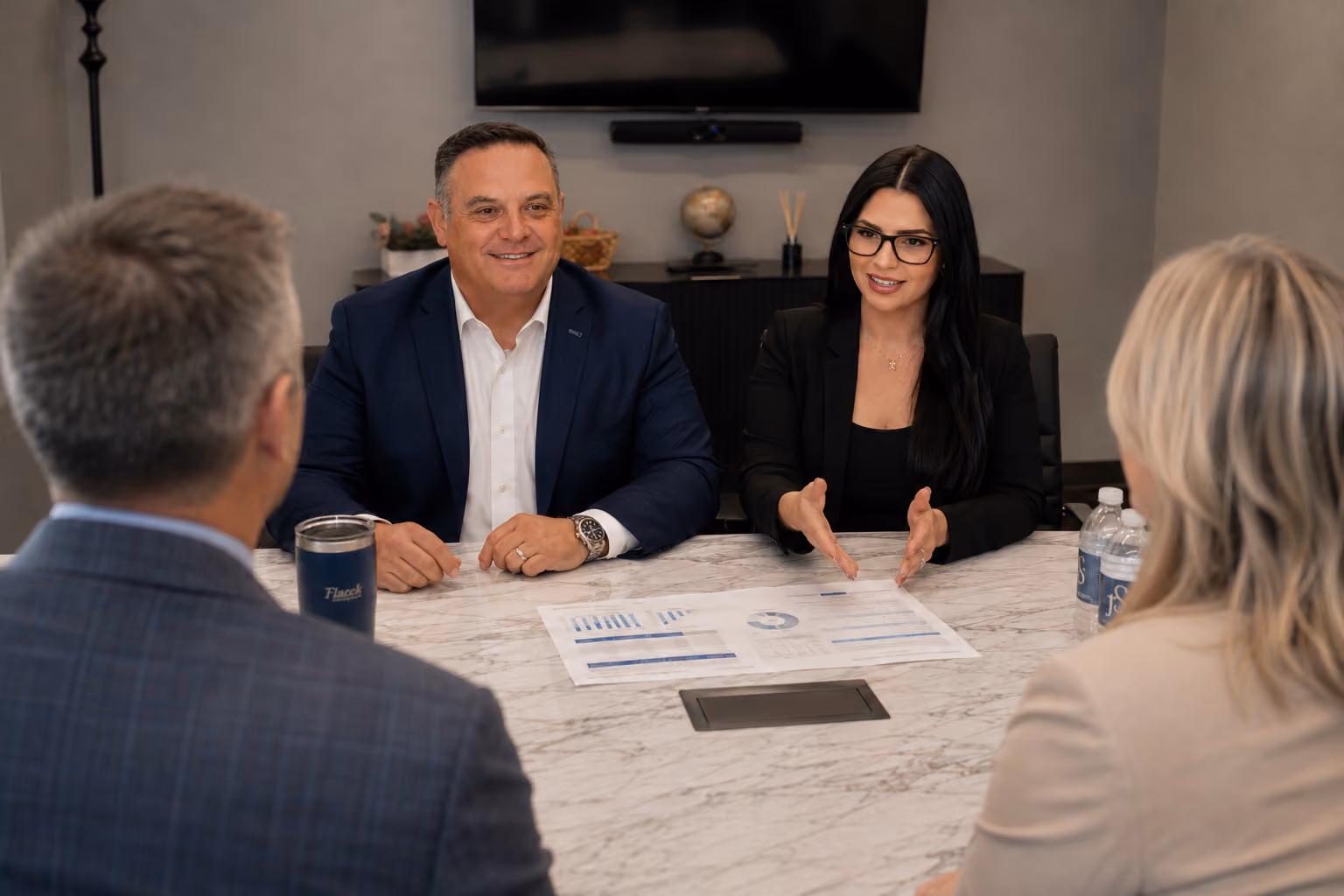 Ftacek Financial Services advisors meeting with a client