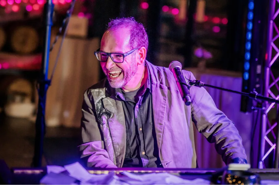 Josh Dupont performing with Piano Fondue at a live dueling pianos show