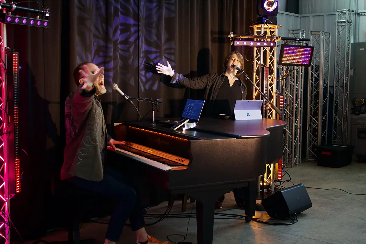 Piano Fondue performers entertaining guests at a live dueling pianos show