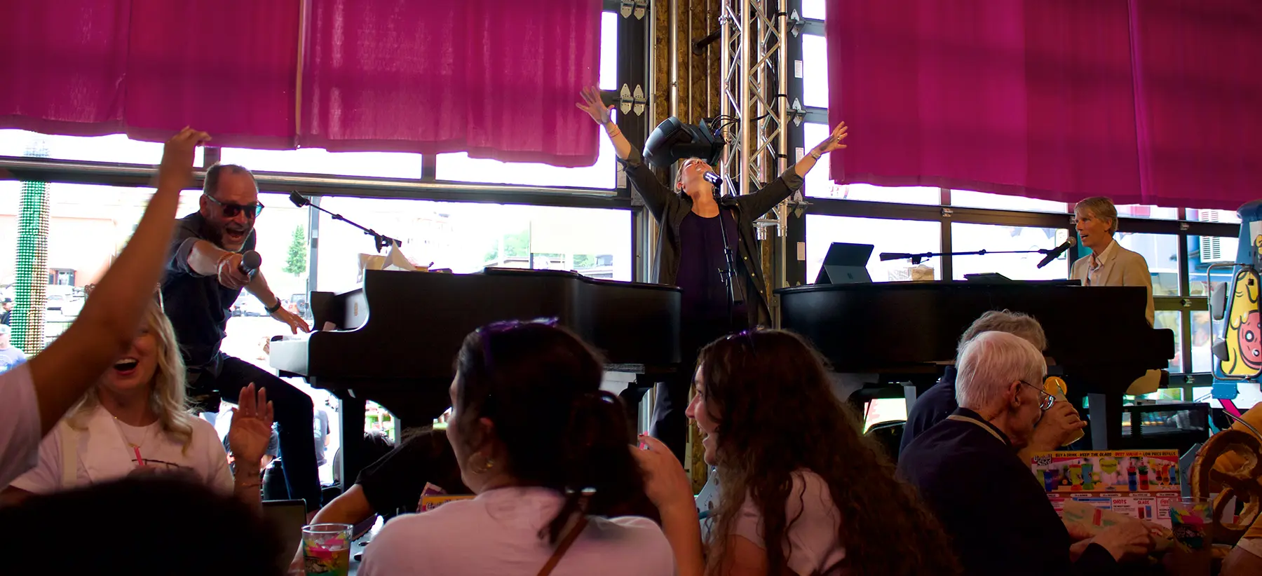 Piano Fondue dueling pianos performers entertaining a crowd at a live show