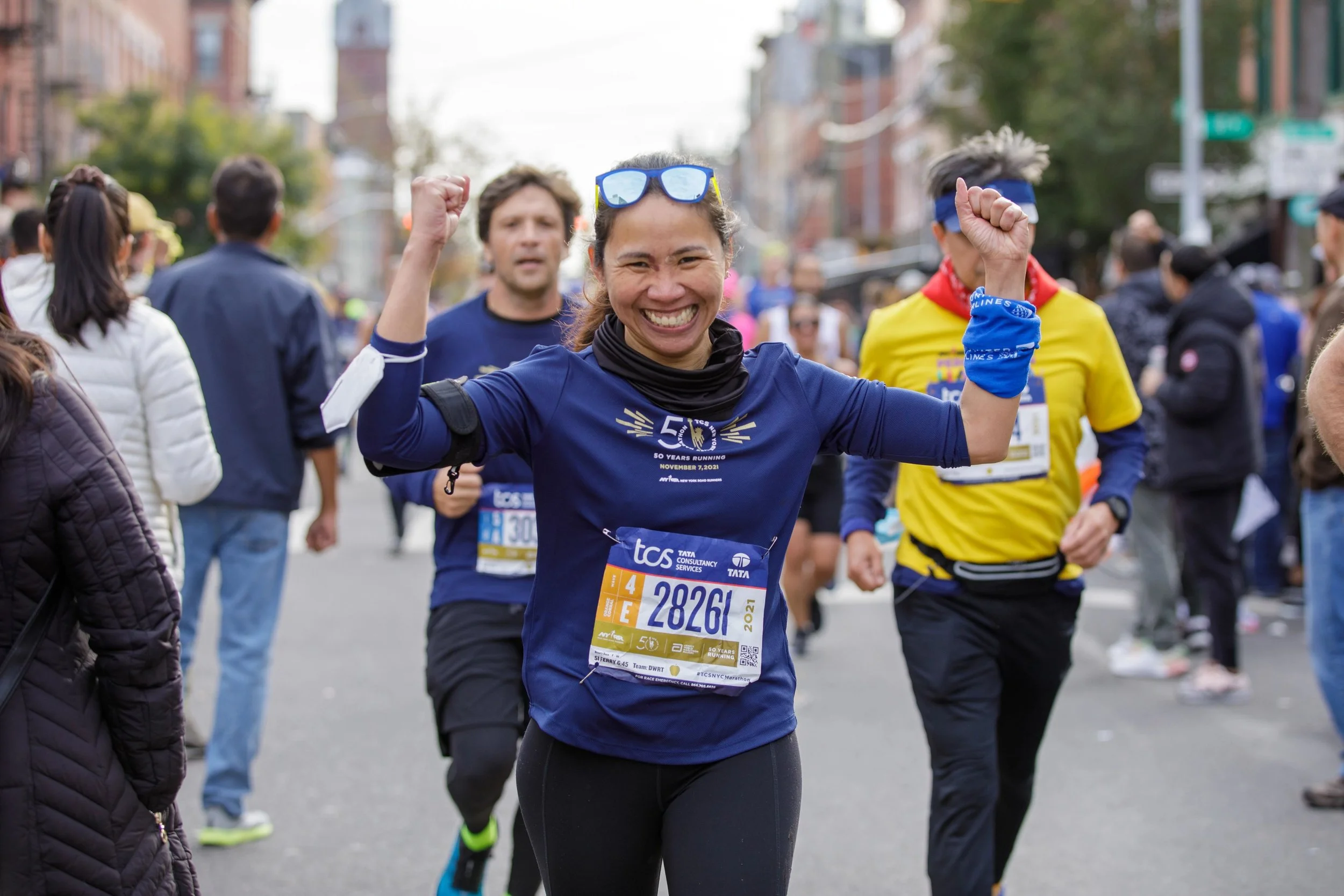 Adults running during a New York Road Runners event